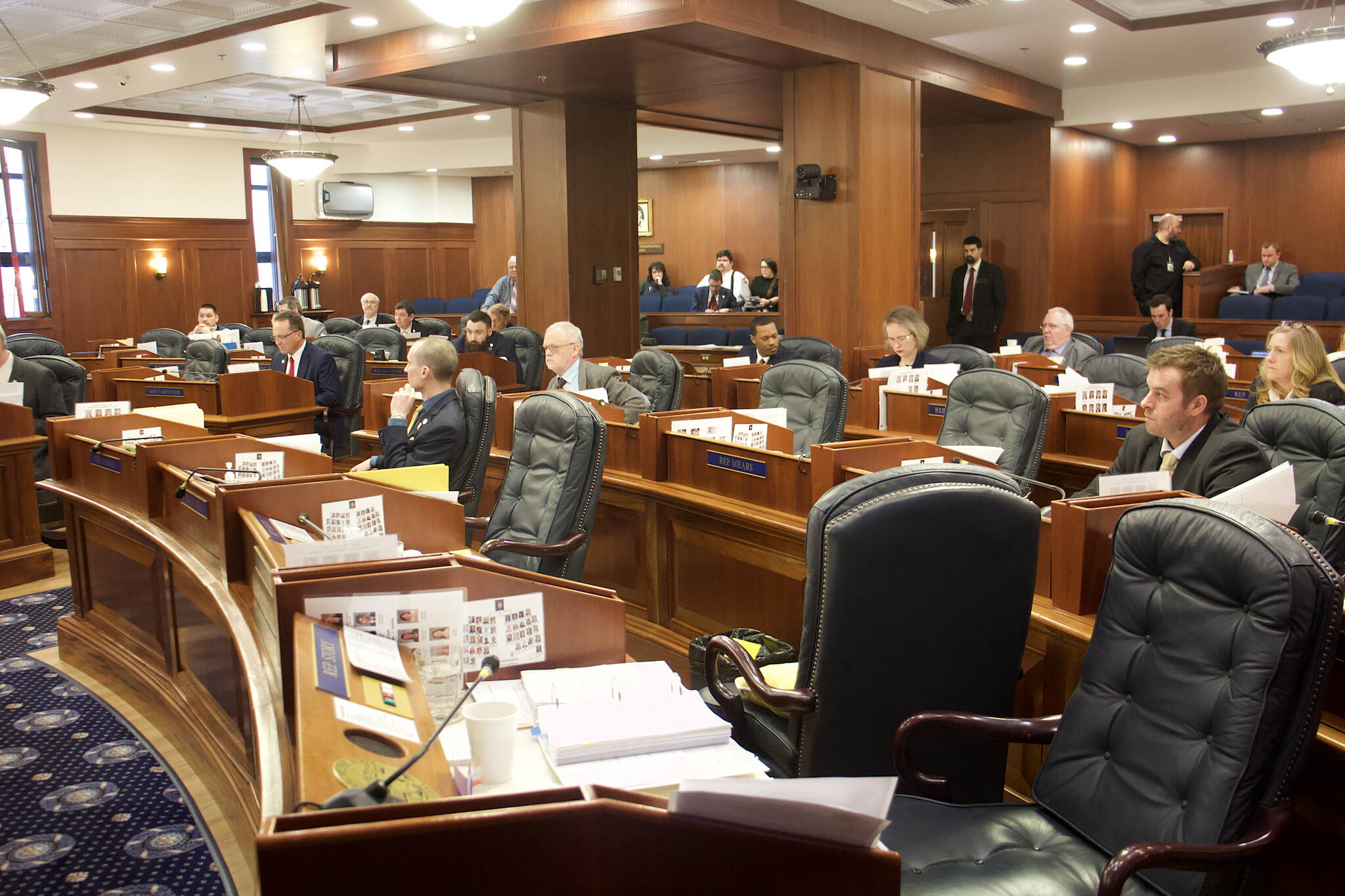All chairs for minority members of the Alaska State House except for Minority Leader Calvin Schrage are empty during Wednesday’s floor session after absent members fled the Alaska State Capitol over a dispute with the majority about an increase in education funding. (Mark Sabbatini / Juneau Empire)