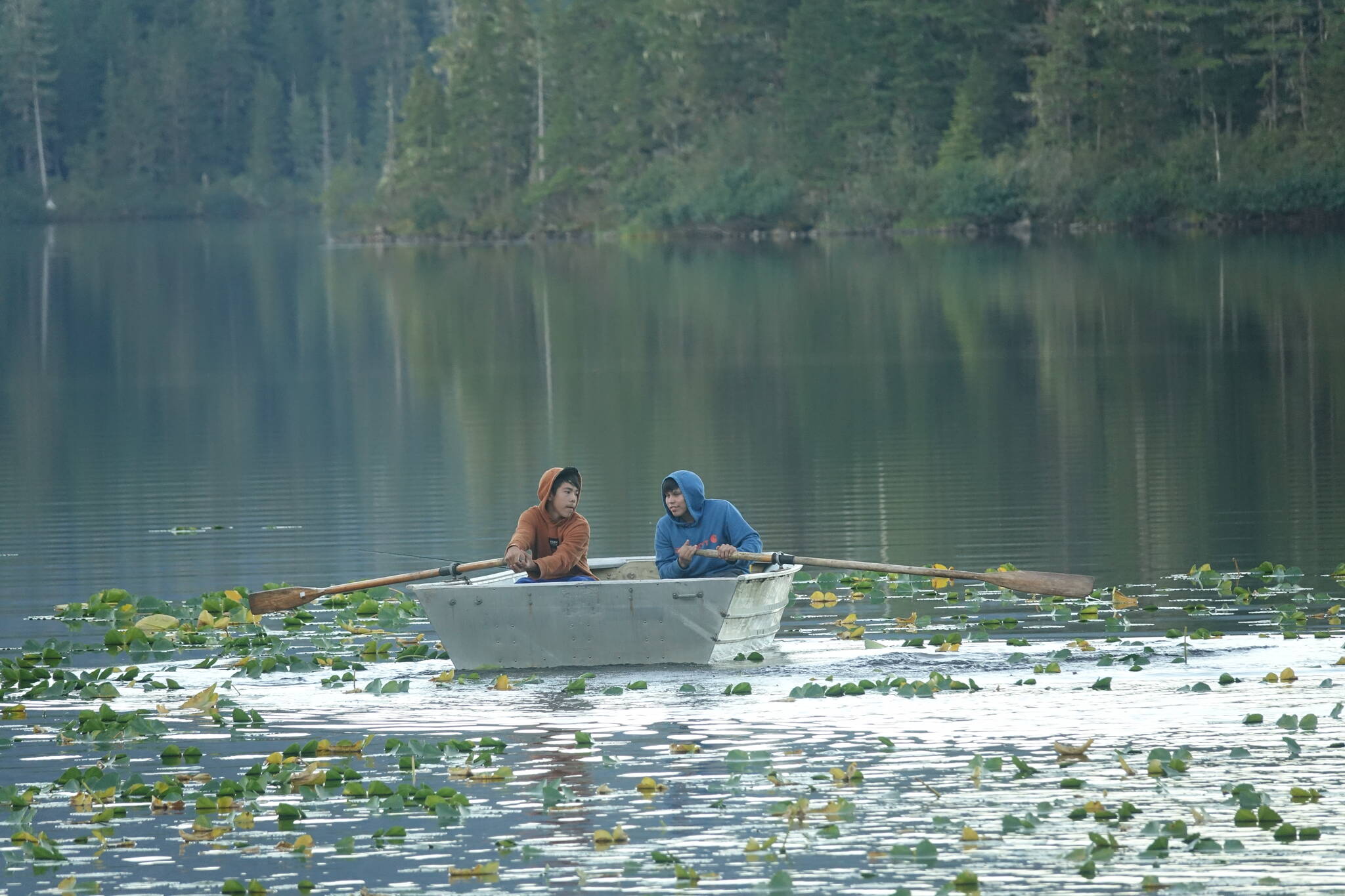 Beebuks Kookesh and Sam Fredrickson test out the rowboat at Hasselborg Creek cabin before they and Trevor Fredrickson went fishing at the mouth of the creek. They caught several fish. (Courtesy Photo / Mary Catharine Martin)