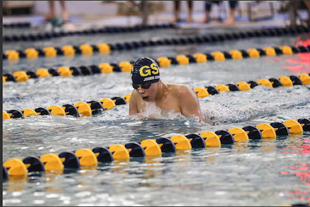 Glacier Swim Club’s Joshua Edwards come up for air during a competition race in the Savannah Cayce Southeast Championship at Juneau’s Dimond Aquatic Center this weekend. Edwards placed third as an individual scorer in the 13/14-year-old boys age group. (Courtesy / Phil Loseby)