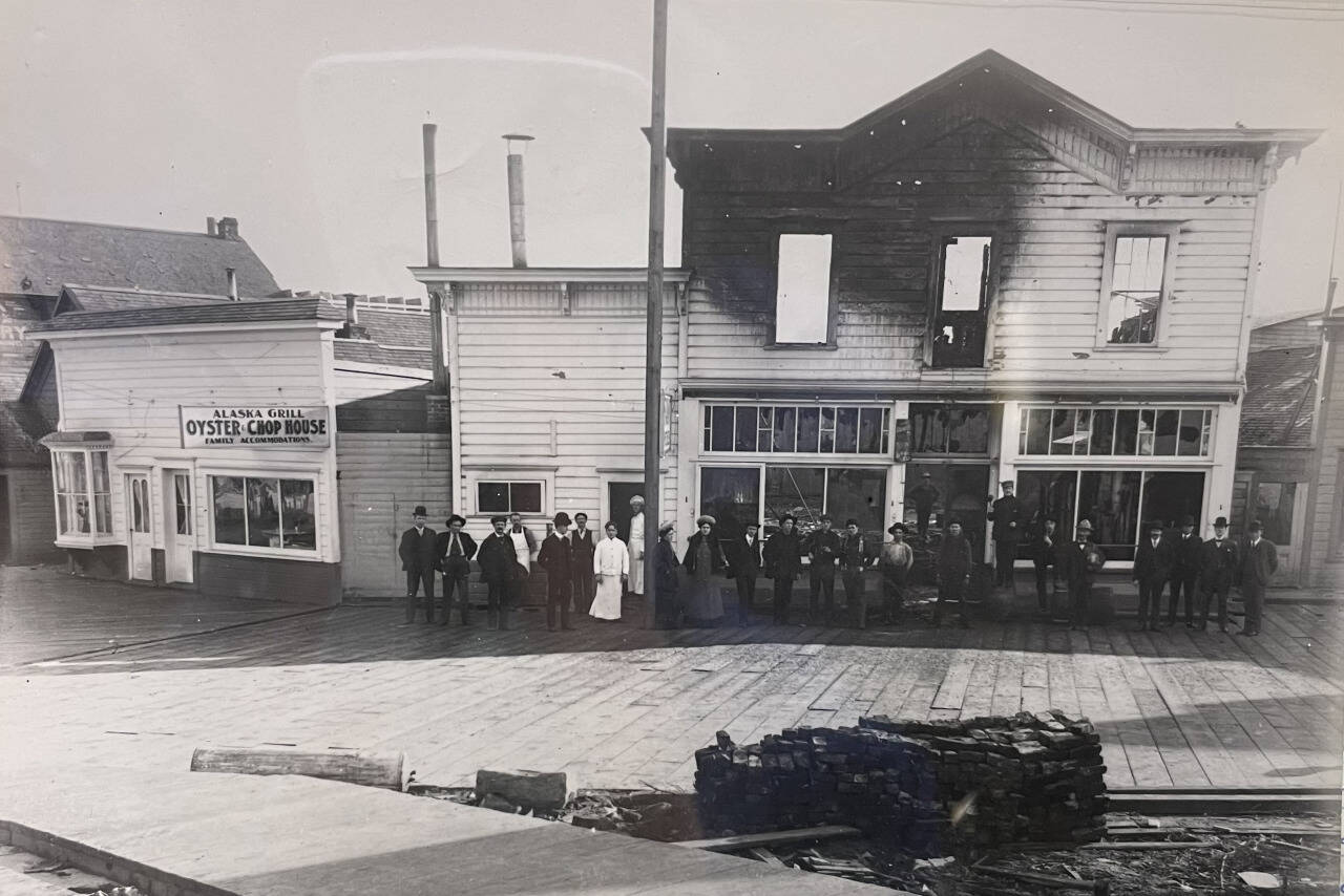In 1906, the popular Louvre Theater burned. To its left is the location of today’s Triangle Club. When this photo was taken, the corner business was the Alaska Grill, advertising oysters and chops, with its separate Ladies Entrance. (Alaska State Library Historical Collection P87-1050)