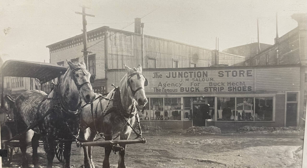 In the 1920s, prohibition closed bars nationwide. The Junction Store occupied the corner that is now the Triangle Club, operated for 76 years by three generations of the Thomas family. The handsome pair of dappled horses are the first drayage team of Reliable Transfer which started hauling in 1913. (Alaska State Library, Historical Collection P87-1049)