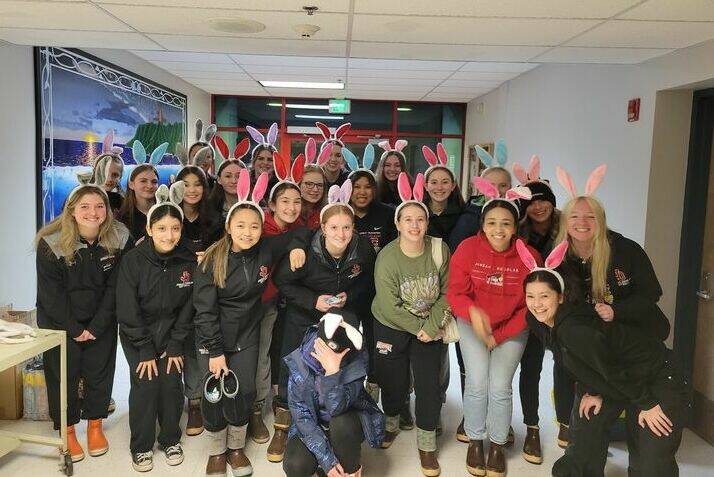 The JDHS softball team poses for team photo on Saturday before delivering eggs to families across Juneau as part of the team’s third annual Egg My House event. (Courtesy Photo / Lexie Razor)