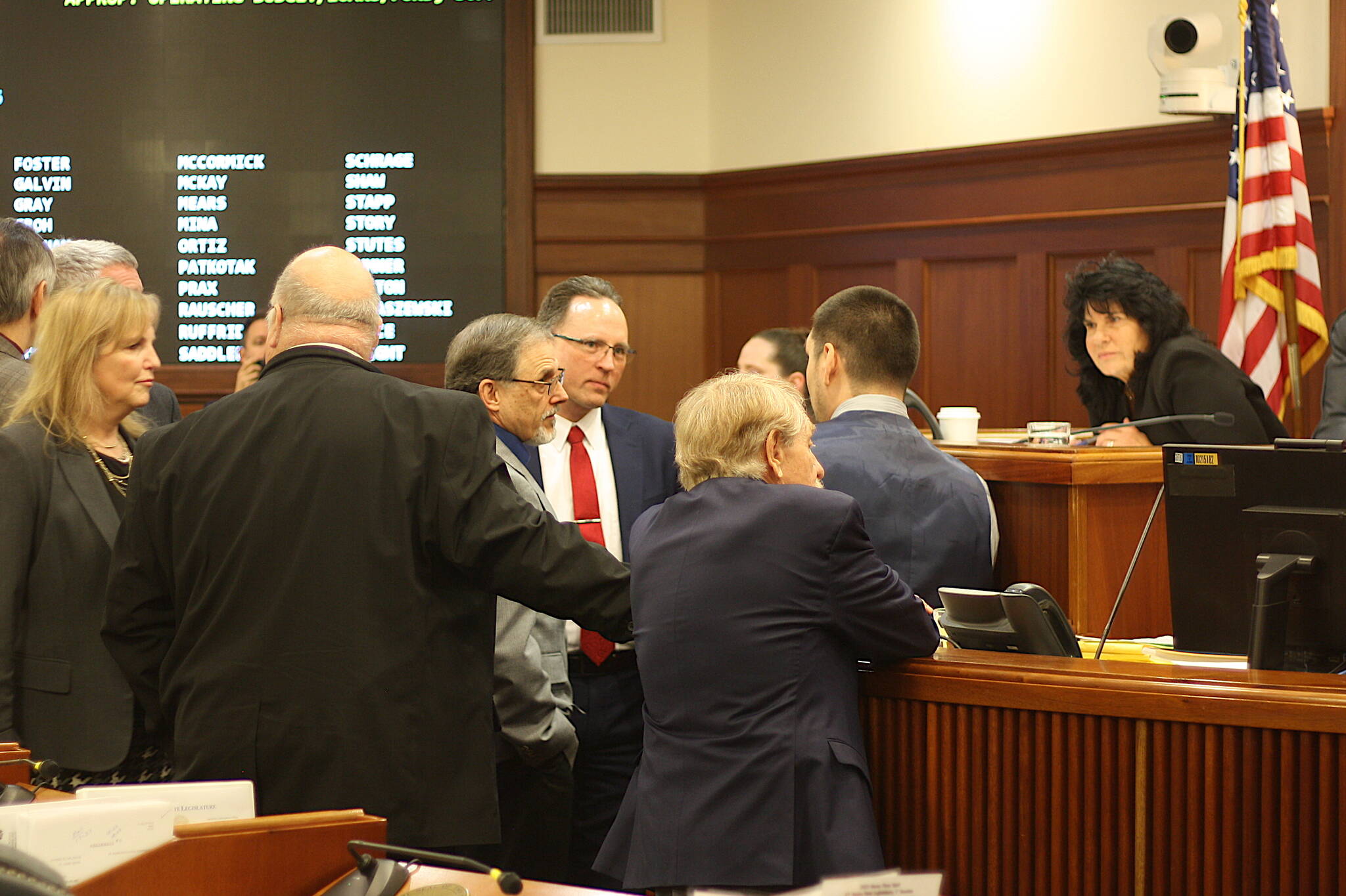 Alaska House Speaker Cathy Tilton, R-Wasilla, right, confers with other House members during a break in the floor debate last Wednesday about next year’s proposed budget. She said the original plan of passing a budget last week has shifted due to discussions with the Senate about resolving differences in their spending plans, with a floor vote now planned by early next week.