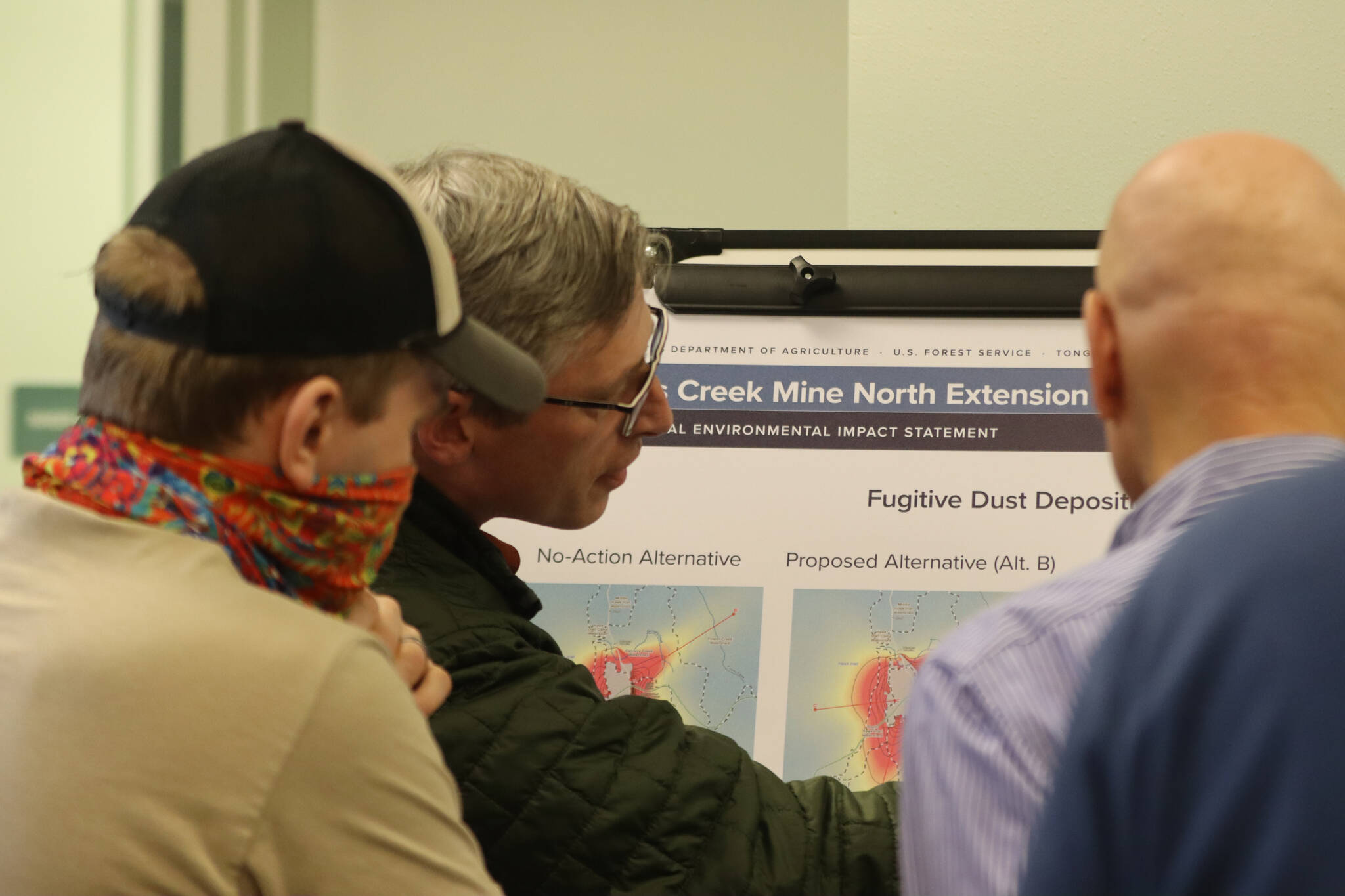 Members of the Juneau Forest Service along with Hecla staff answer questions posed by the public regarding the Greens Creek Mine expansion alternatives on Wednesday during an open house hosted by the Juneau Ranger District. (Jonson Kuhn / Juneau Empire)
