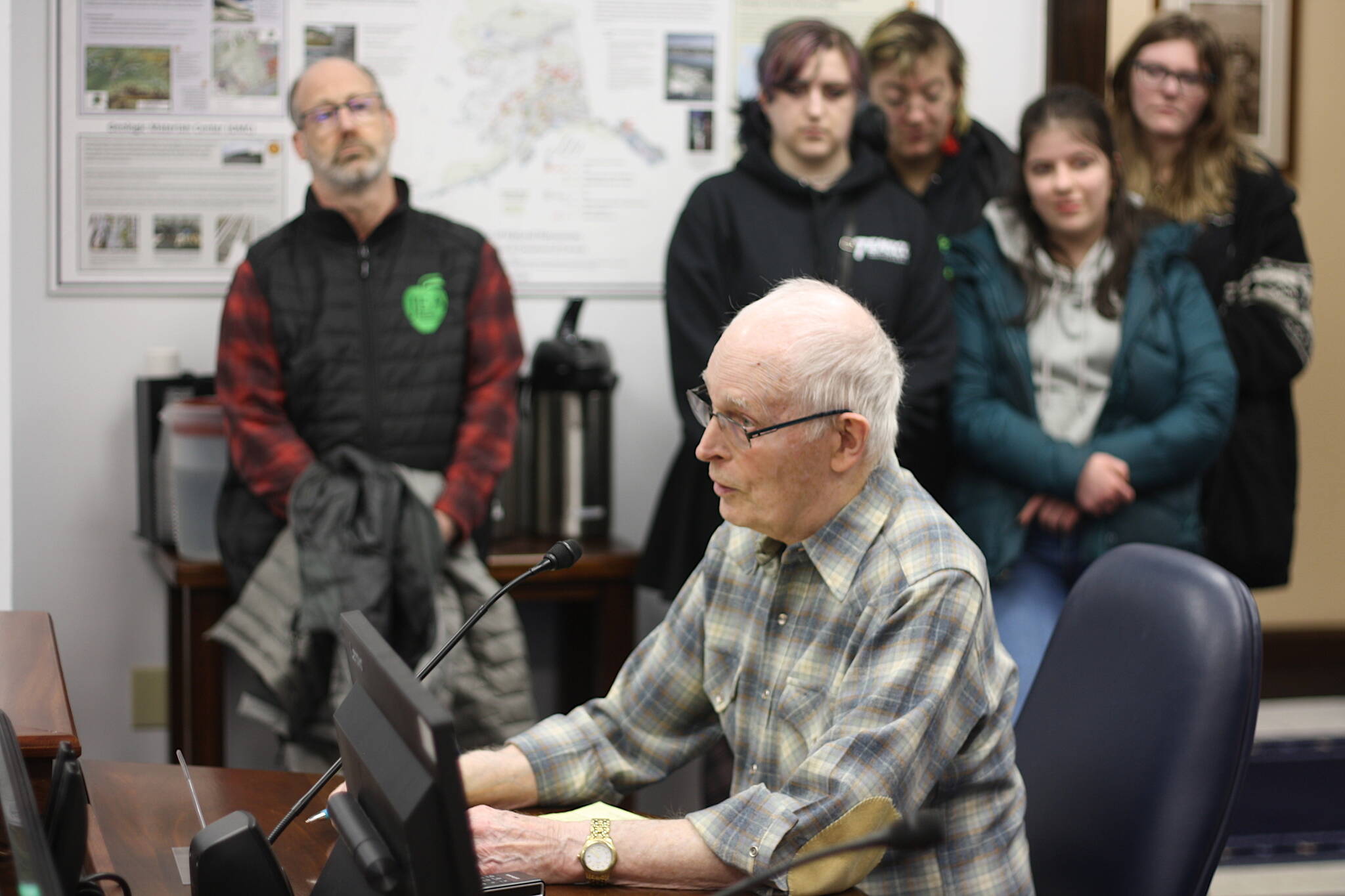 Ron Soherville, a Juneau resident, testifies in favor of a bill restricting sex and gender content in public schools during a House Education Committee meeting Thursday night. He was surrounded by a crowd of mostly students who testified against the bill. (Mark Sabbatini / Juneau Empire)