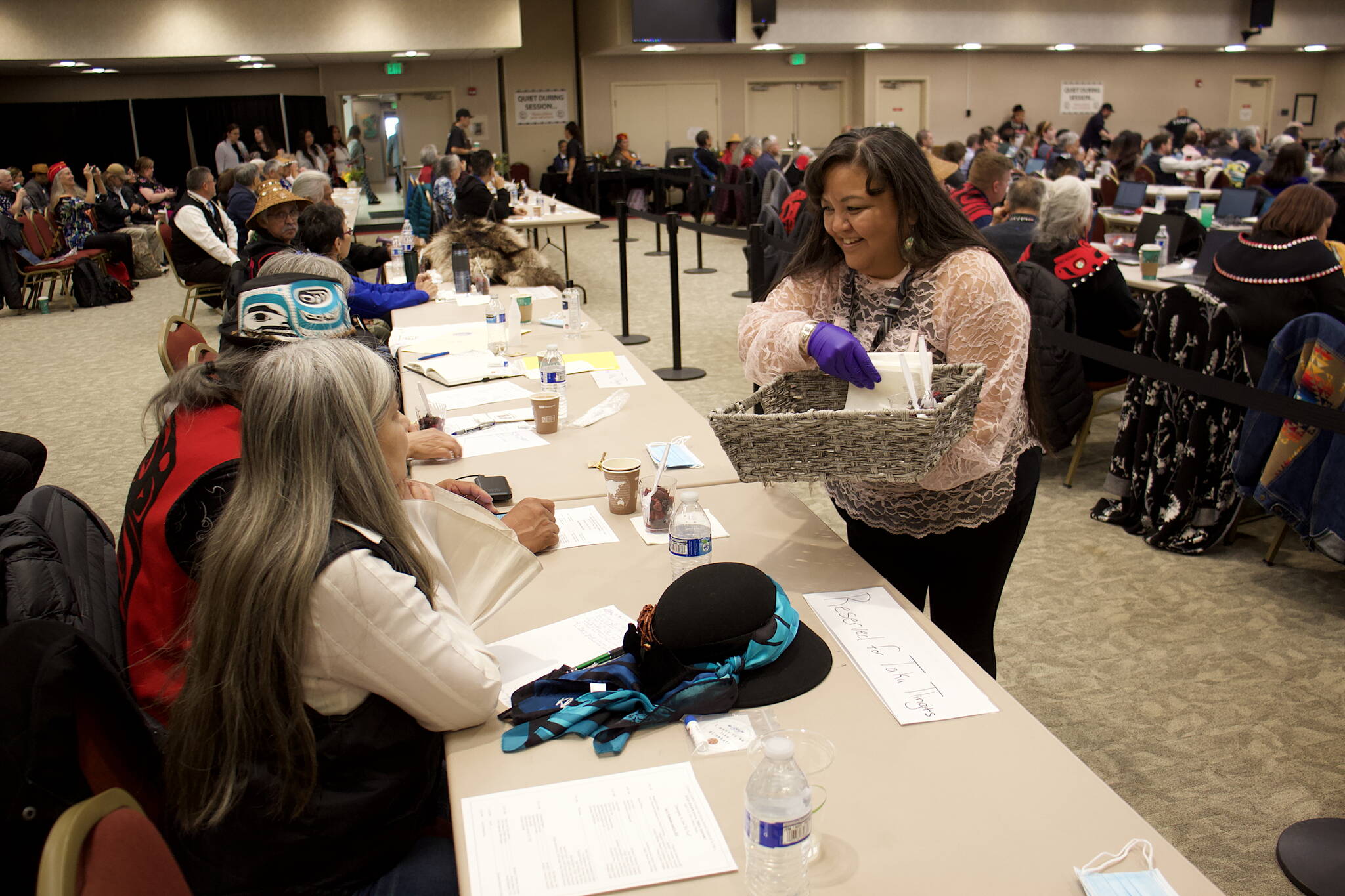 Ann Stepetin, a wellness coordinator for Tlingit Haida’s Tribal Family Youth Services department, serves berries to delegates Wednesday during the annual tribal assembly at Elizabeth Peratrovich Hall. (Mark Sabbatini / Juneau Empire)