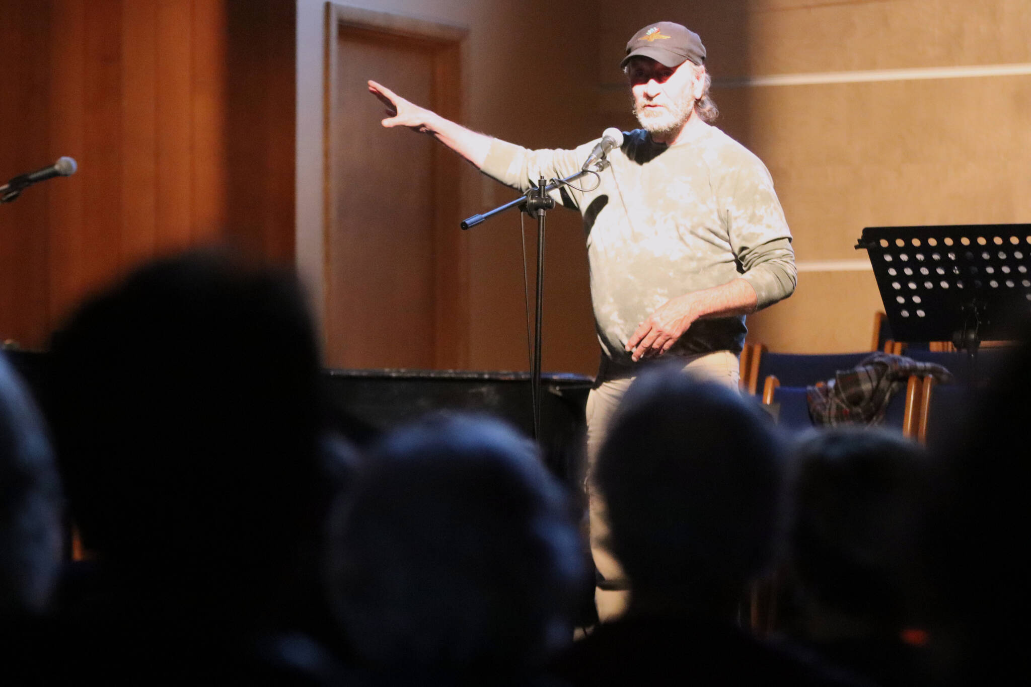 Alan Cleveland shares his experiences as a Juneau taxi driver to a packed house at Ḵunéix̱ Hídi Northern Light United Church as part of Mudrooms final showcase of the season on Tuesday night. (Jonson Kuhn / Juneau Empire)