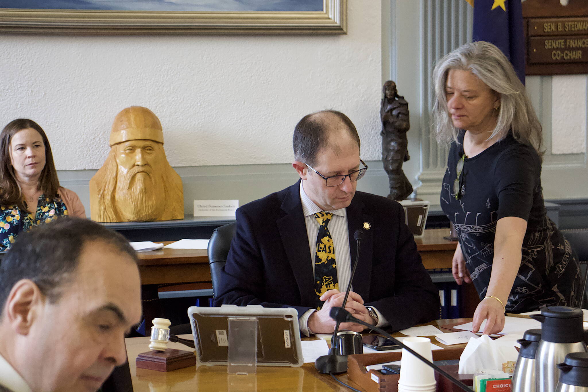 State Sen. Jesse Kiehl, D-Juneau, receives a note while presiding over public testimony from Juneau residents about next year’s proposed state budget during a Senate Finance Committee meeting Thursday. (Mark Sabbatini / Juneau Empire)