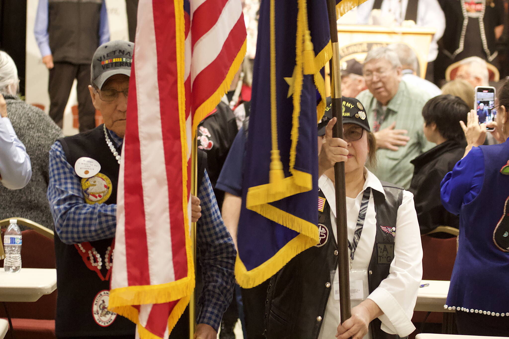 A color guard of Southeast Alaska Native Veterans carry the flags out from Elizabeth Peratrovich Hall on Friday to close the three-day 88th Tribal Assembly of the Central Council of the Tlingit and Haida Indian Tribes of Alaska. (Mark Sabbatini / Juneau Empire)