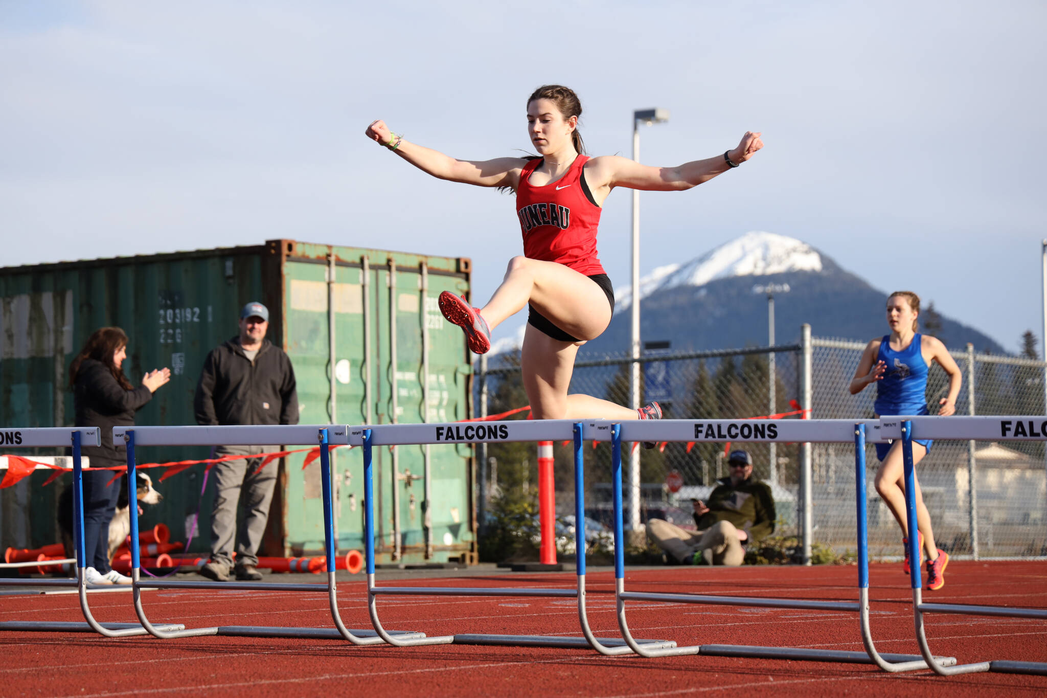 Juneau-Douglas High School: Yadaa.at Kalé sophomore Serena Crupi jumps over a hurdle at the Capital Invitation Track and Field Meet at Thunder Mountain High School Friday evening. (Clarise Larson / Juneau Empire)