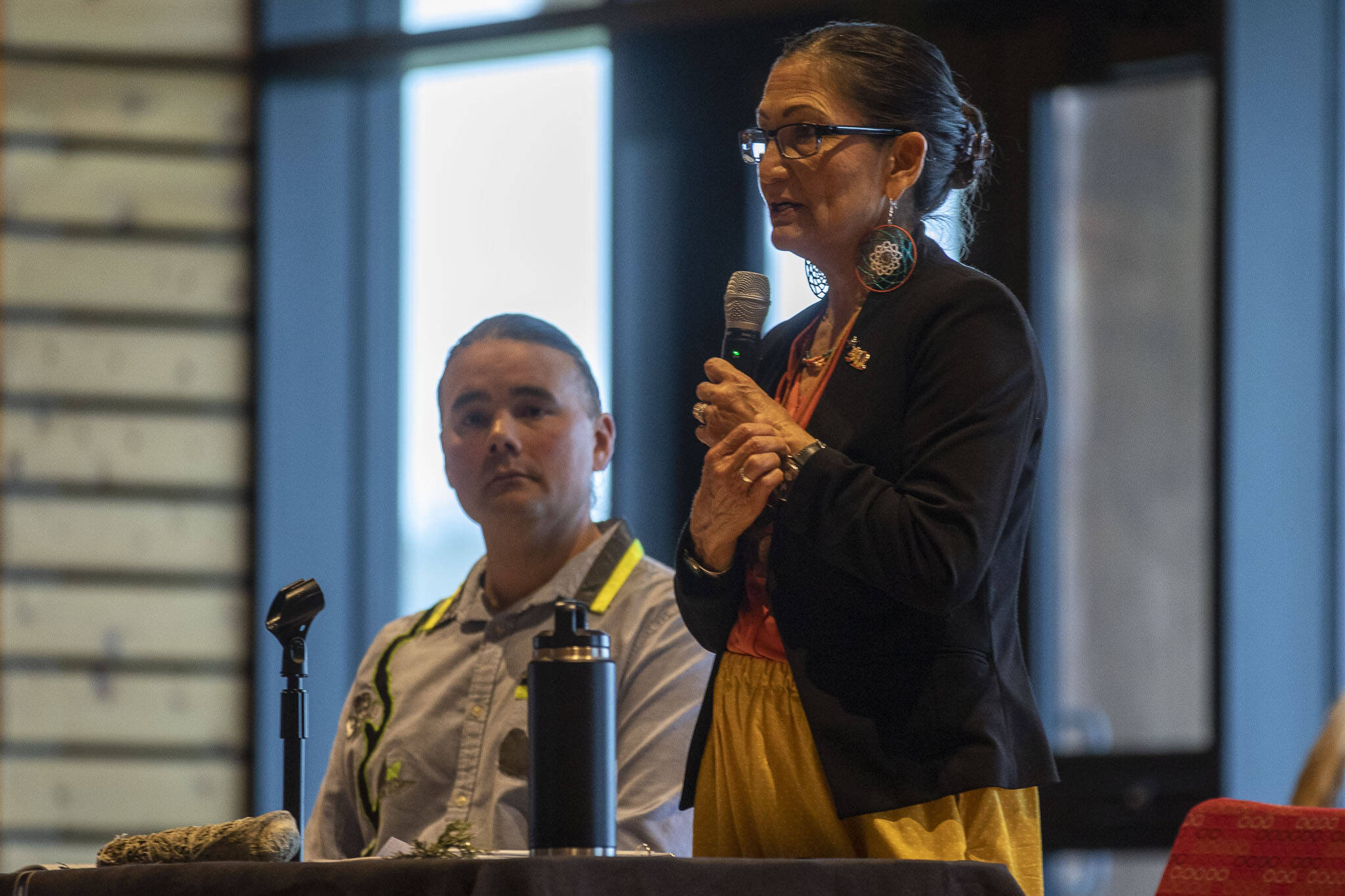 United States Secretary of the Interior Deb Haaland, right, speaks during a Road to Healing event at the Tulalip Gathering Hall in Marysville, Washington on Sunday, April 23, 2023. The tour is lead by Haaland and Department of the Interior Assistant Secretary Bryan Newland. (Annie Barker / The Herald)
