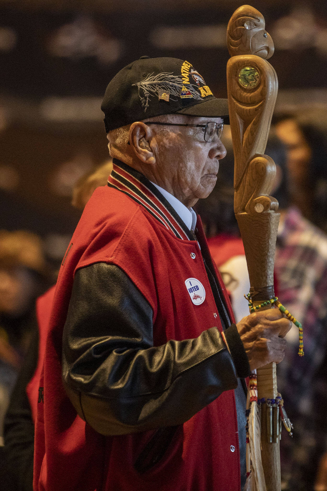 A member of the color guard walks during the procession during a Road to Healing event at the Tulalip Gathering Hall in Marysville, Washington on Sunday, April 23, 2023. The tour is lead by United States Secretary of the Interior Deb Haaland and Department of the Interior Assistant Secretary Bryan Newland. (Annie Barker / The Herald)