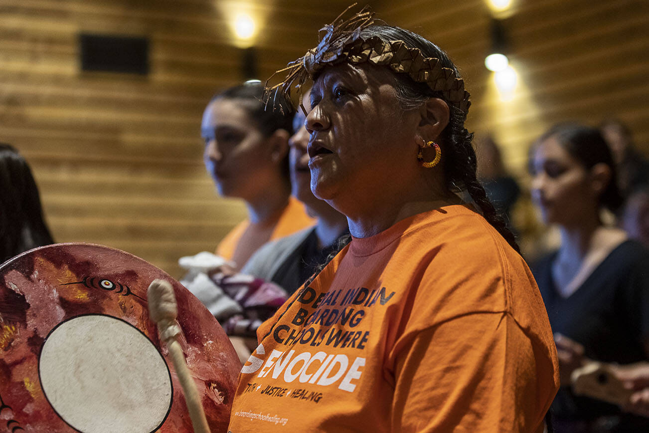 Tulalip tribal members perform a welcome song during a "Road to Healing" event at the Tulalip Gathering Hall in Marysville, Washington, on Sunday, April 23, 2023. (Annie Barker / The Herald)
