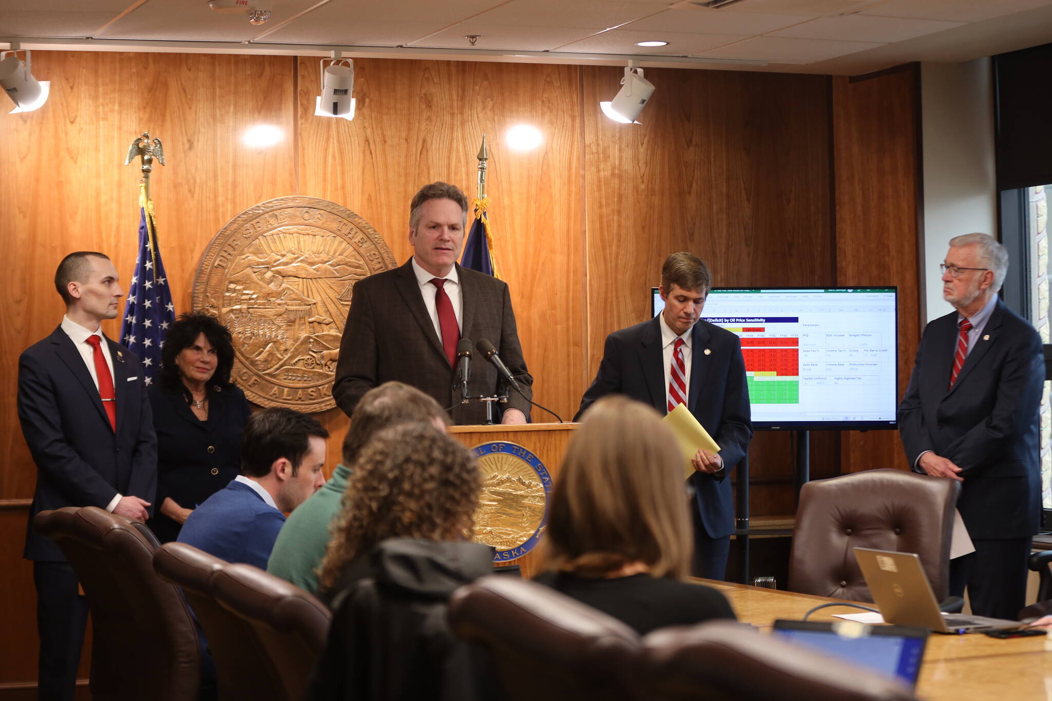 Gov. Mike Dunleavy, accompanied by state House and Senate leaders, discuss options for a long-range fiscal plan during a press conference Thursday at the Alaska State Capitol. (Clarise Larson / Juneau Empire)