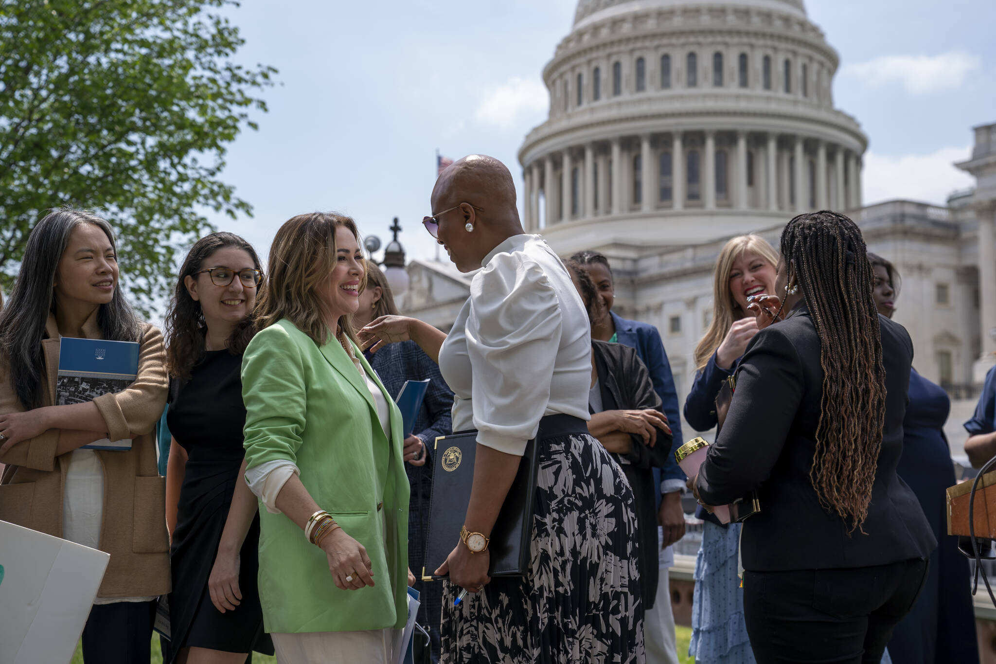 Activist Alyssa Milano, left, is greeted by Rep. Ayanna Pressley, D-Mass., center, as they arrive to tell reporters they want to remove the deadline for ratification of the Equal Rights Amendment, during a news conference at the Capitol in Washington, Thursday, April 27, 2023. Senate Republicans on Thursday blocked a Democratic measure to revive the Equal Rights Amendment. (AP Photo / J. Scott Applewhite)