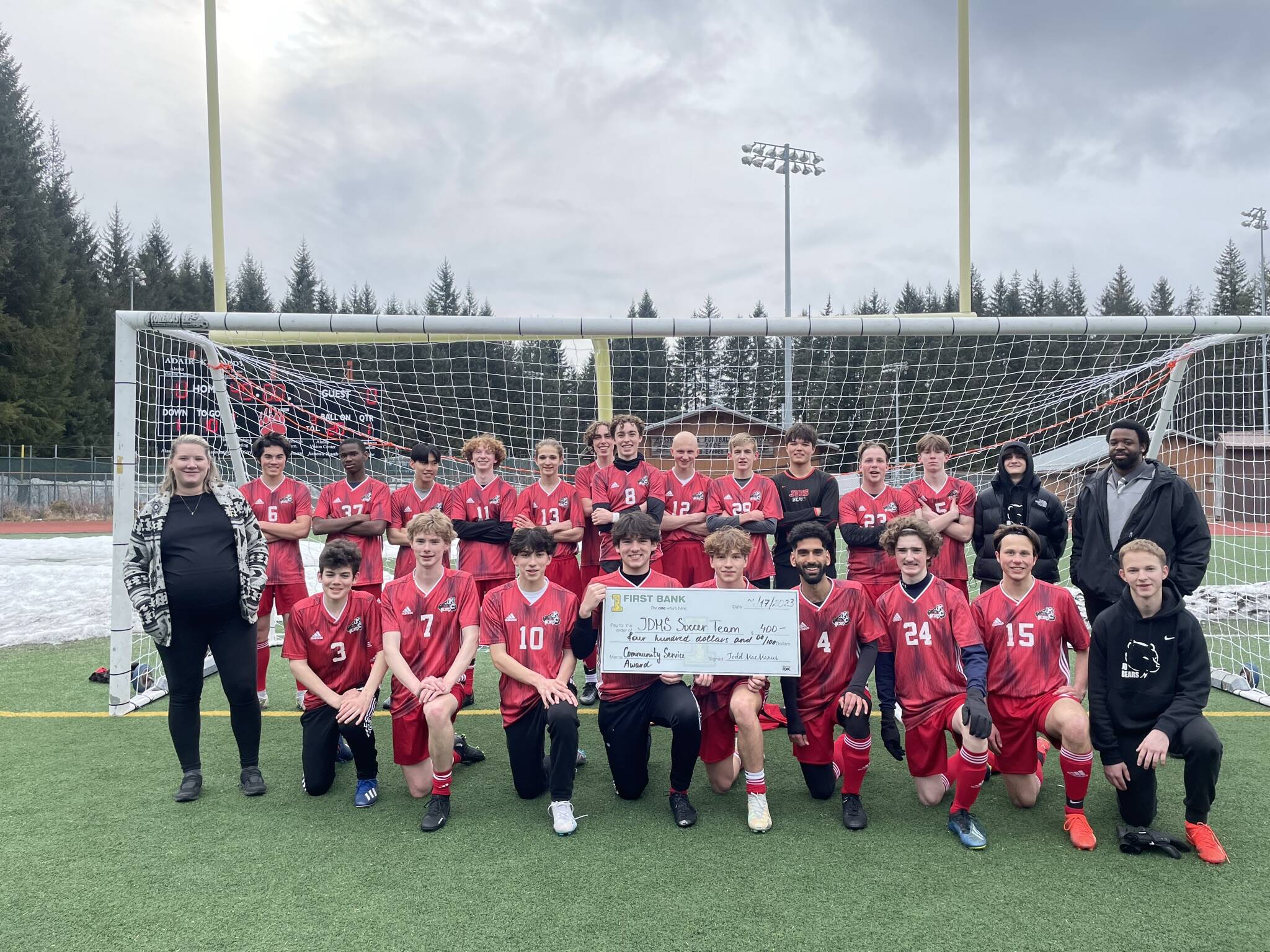 The Juneau-Douglas High School: Yadaa.at Kalé boys soccer team recently earned a Community Service Award from First Bank.  (Courtesy Photo)