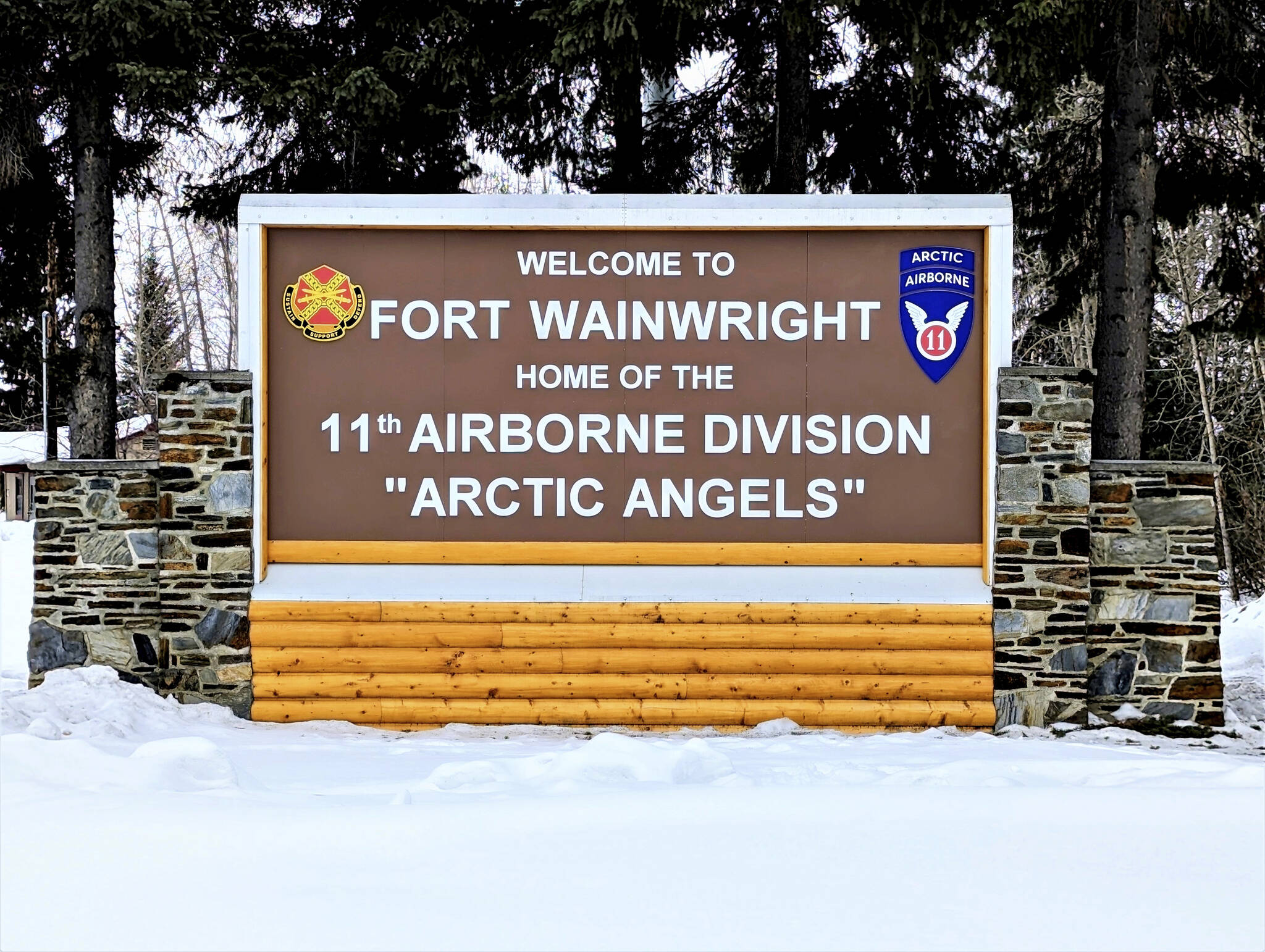 This photo provided by Fort Wainwright Public Affairs Office shows a recently installed sign at the main entry point to U.S. Army Garrison Alaska Fort Wainwright on April 5, 2023, in Fairbanks, Alaska. The mother of Warrant Officer 1 Stewart Duane Wayment, one of the three soldiers killed last week when two U.S. Army helicopters at Fort Wainwright collided as they were returning from training in a remote part of Alaska, said her son loved his country and his family and lifted others up.  An investigative team flew to the crash site Monday, May 1.  (Eve Baker / Fort Wainwright Public Affairs Office)