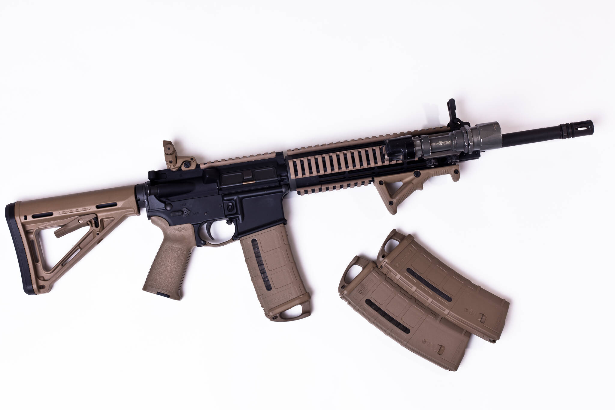 This image available under a Creative Commons license shows an AR-15 with magazines. (docmonstereyes / Flickr)