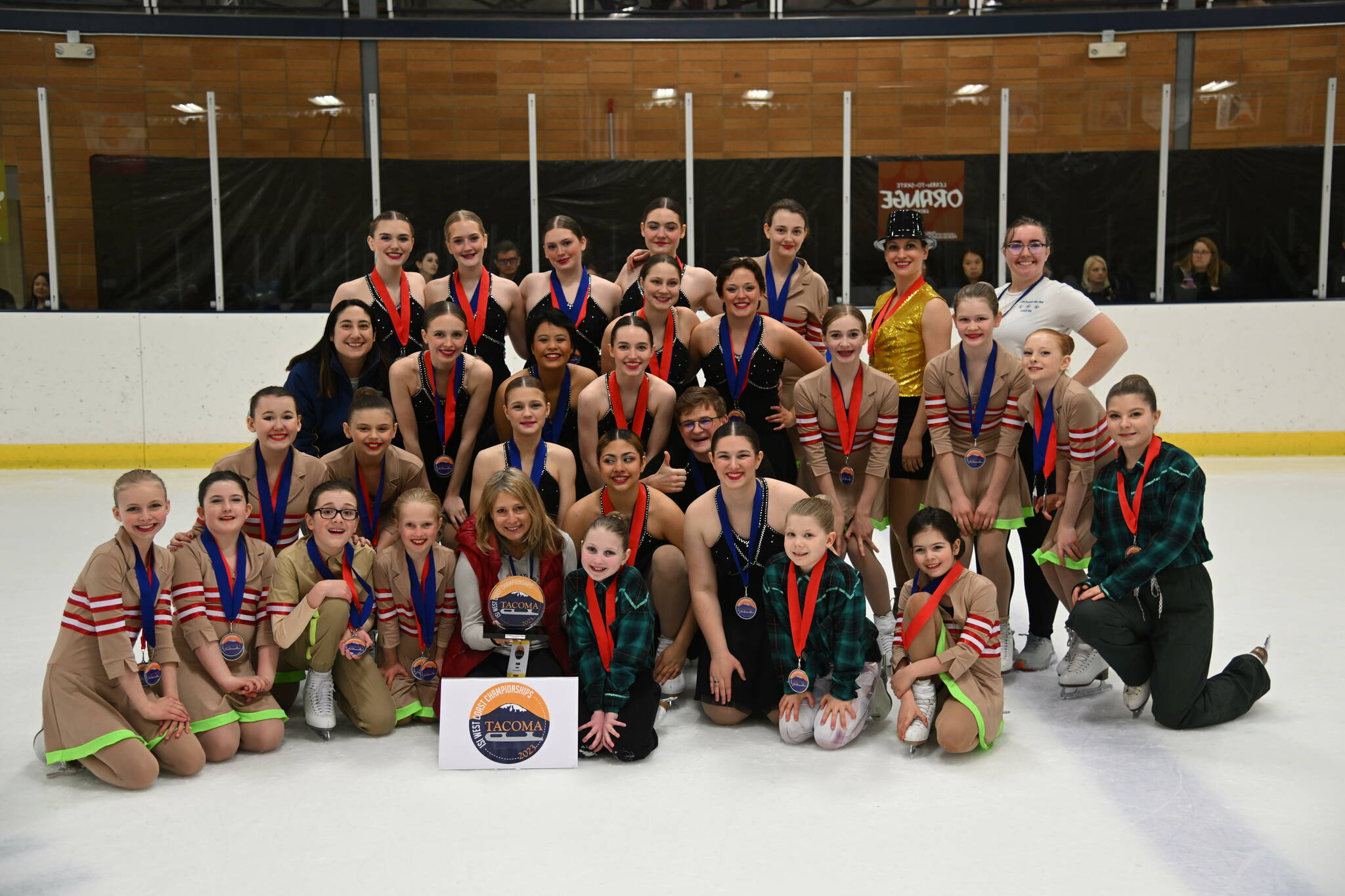 The Juneau Skating Club poses for a group photo after taking third place overall in the 2023 Ice Sports Industry West Coast Championship in Tacoma, Washington at the end of April. (Courtesy Photo / Marianne Oelund)