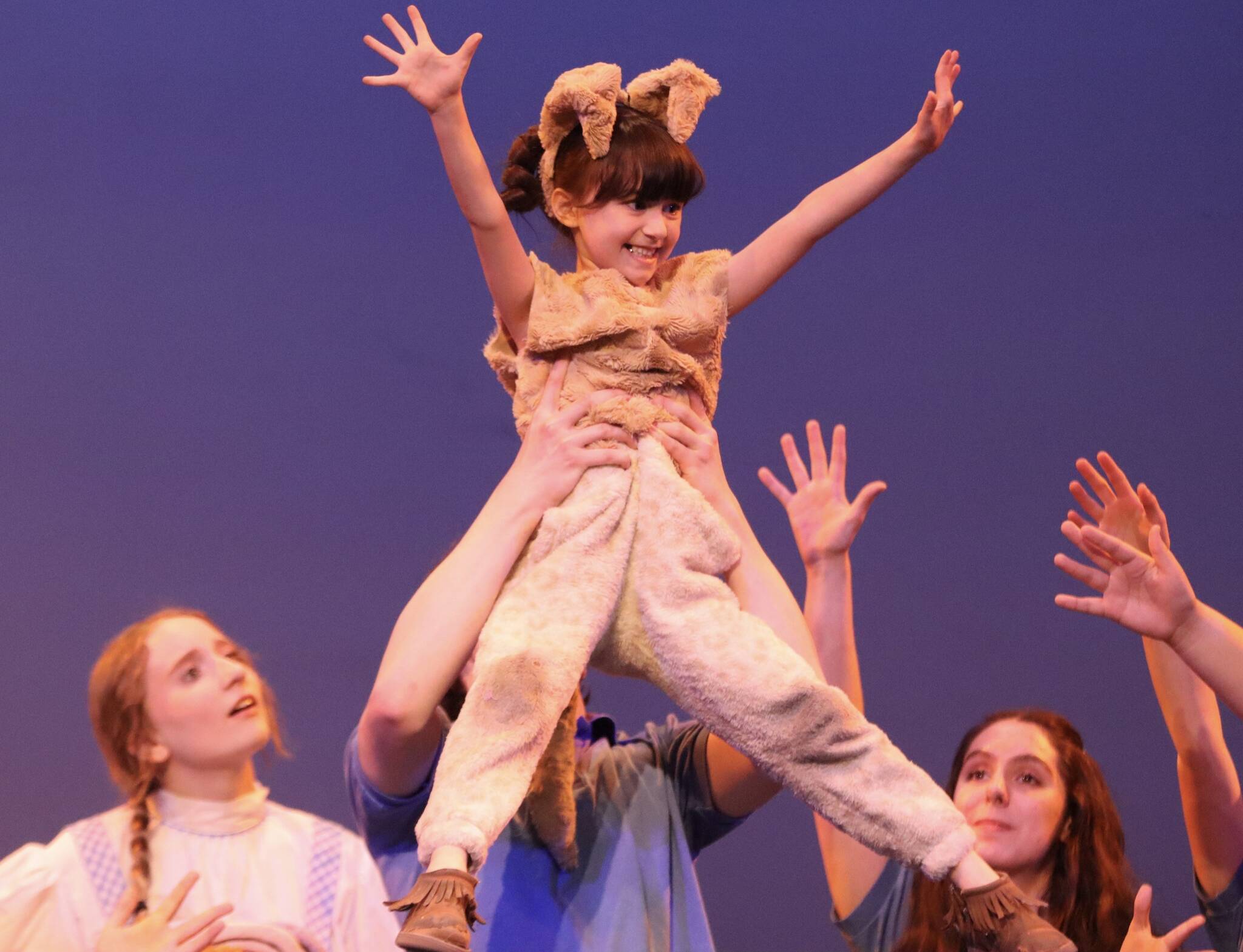 Delia Grimes,7, plays the part of Toto in this year’s rendition of “The Wizard of Oz”, which has a cast consisting of both JDHS and TMHS students and is performed at the JDHS auditorium. (Jonson Kuhn / Juneau Empire)