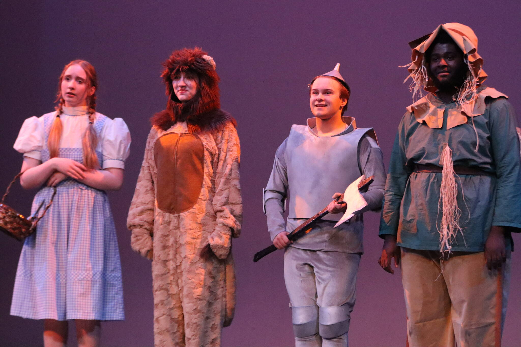 From left to right, Megan Peirce, Ava Grimes, Kyra Wood and Johnathan Gee-Miles star in Juneau high school’s collaborative production of the classic “The Wizard of Oz” at JDHS auditorium. (Jonson Kuhn / Juneau Empire)