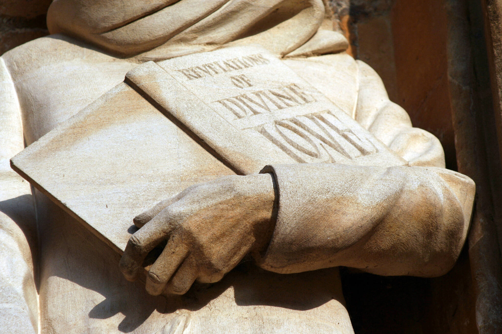 This photo available under a Creative Commons license shows a statue of Julian of Norwich holding her book "Revelations of Divine Love." Leo Reynolds / Flickr)