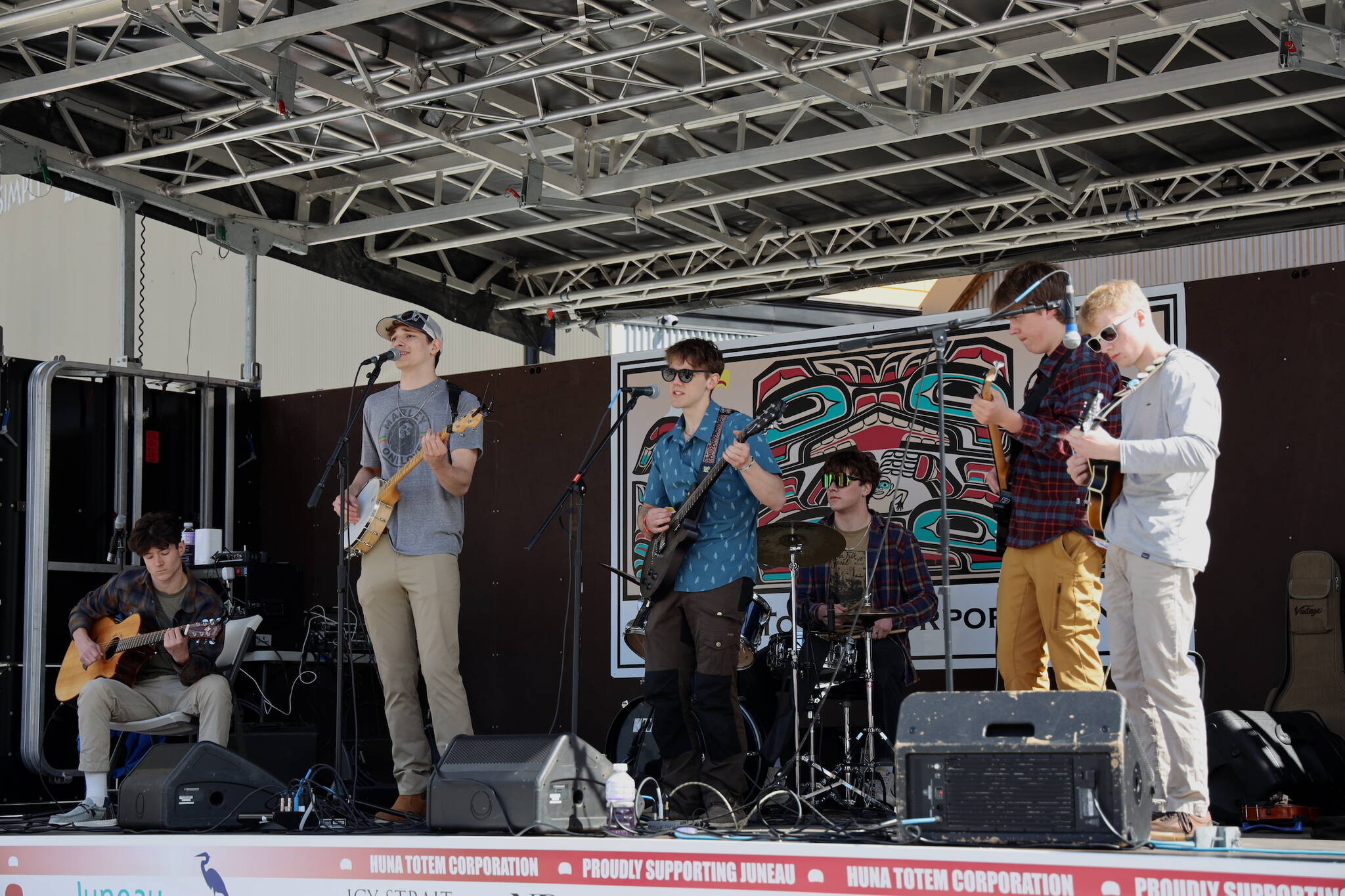 From left to right, seniors Eli Crupi, Lake Bartlett, Aidan Kovach, Brandon Campbell, Jack Schwarting and Finn Kesey perform on stage during the 2023 Juneau Maritime Festival Saturday afternoon at the Elizabeth Peratrovich Plaza. The band, known as the Radio Flyers, have been playing together since they were in the 5th grade. The performance Saturday was one of the band’s last together before the members leave for college. (Clarise Larson / Juneau Empire)