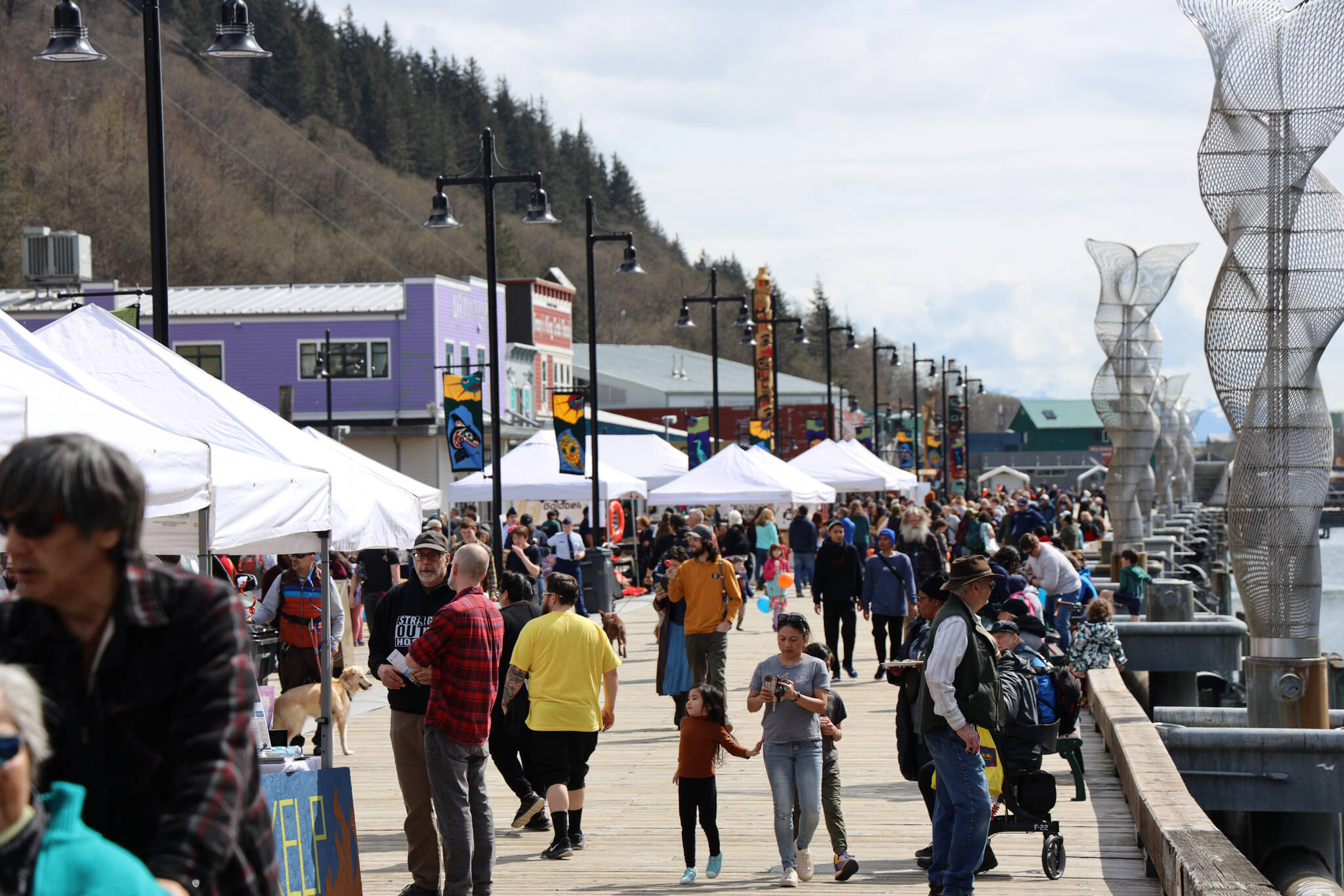 Hundreds walk the waterfront near Elizabeth Peratrovich Plaza Saturday afternoon during the 2023 Juneau Maritime Festival. (Clarise Larson / Juneau Empire)