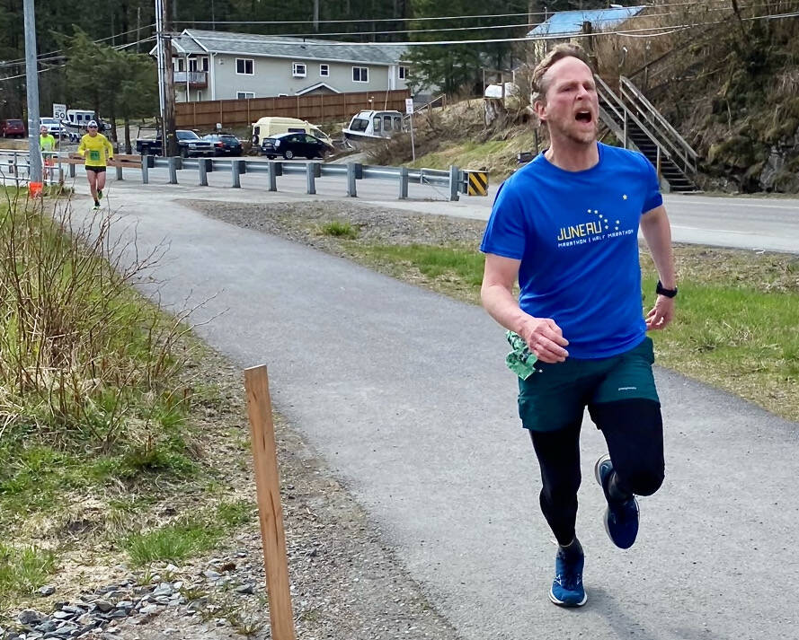 Hiram Henry, 48, wins the 7.5-mile run in the Magnificent Mendenhall Mudpuddle Meet on Saturday. (Courtesy Photo / Quinn Tracy/ Heather Parker)