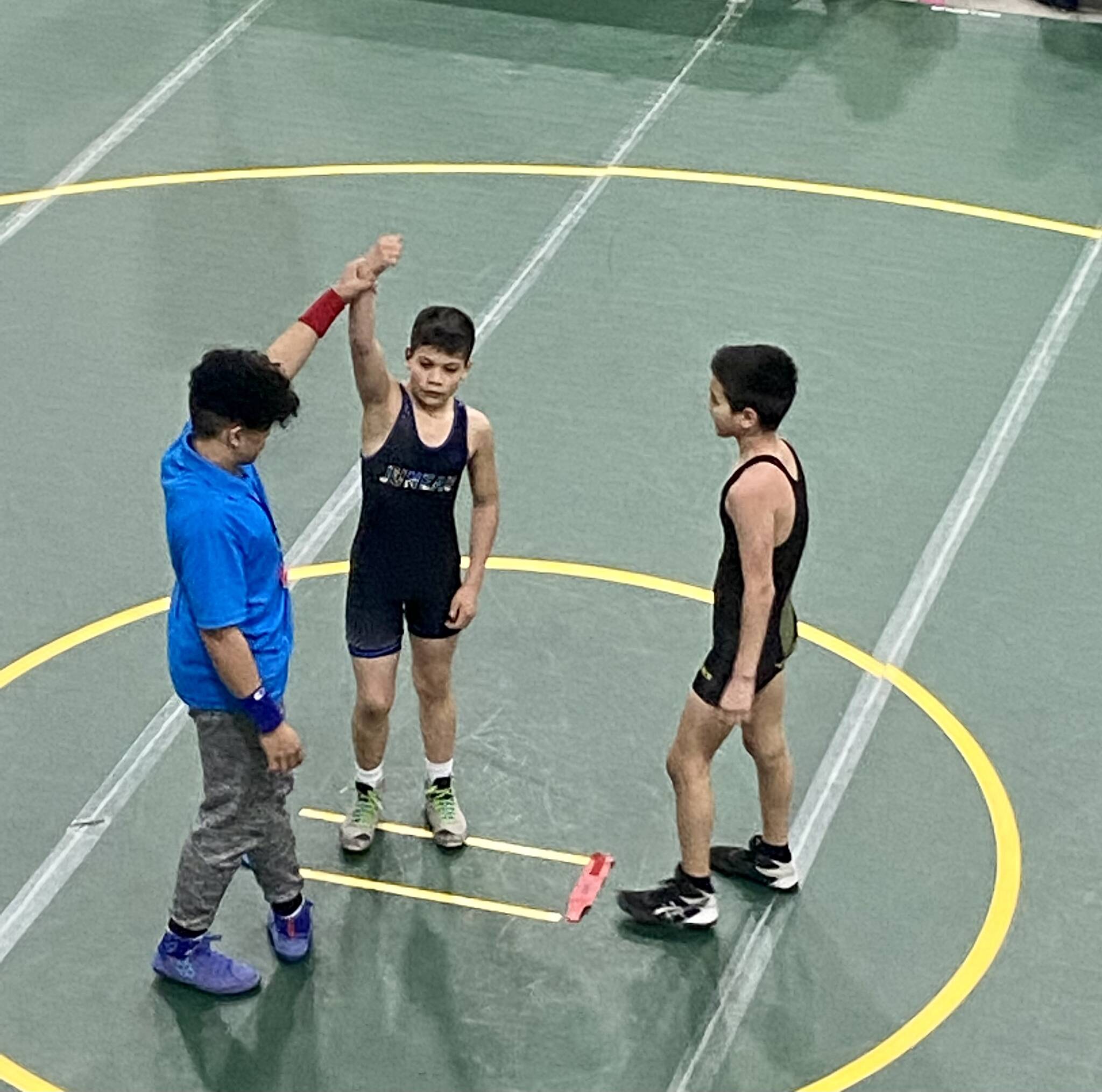 Caleb Aube (JYWC) gets his hand raised in victory over Maxwell Shellabarger (Dillingham Wrestling Club) at the USA Wrestling Alaska State Championships at the Menard Center in Wasilla from May 3-7. (Courtesy Photo / William Dapcevich)