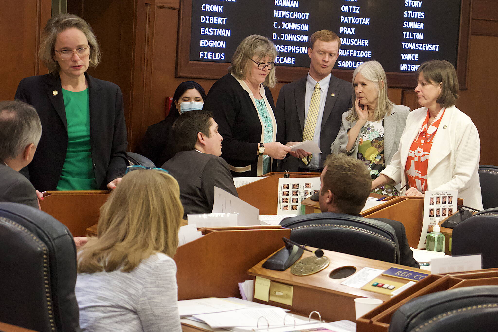 State House members with wide-ranging views on a so-called “fentanyl bill,” including both of Juneau’s representatives, discuss proposed amendments during Wednesday’s floor session. Standing from left to right are Sarah Vance, R-Homer, Sara Hannan, D-Juneau, David Eastman, R-Wasilla, Andi Story, D-Juneau, and Alyse Galvin, D-Anchorage. The bill passed by a 35-5 vote Thursday, with Story voting in favor and Hannan against.