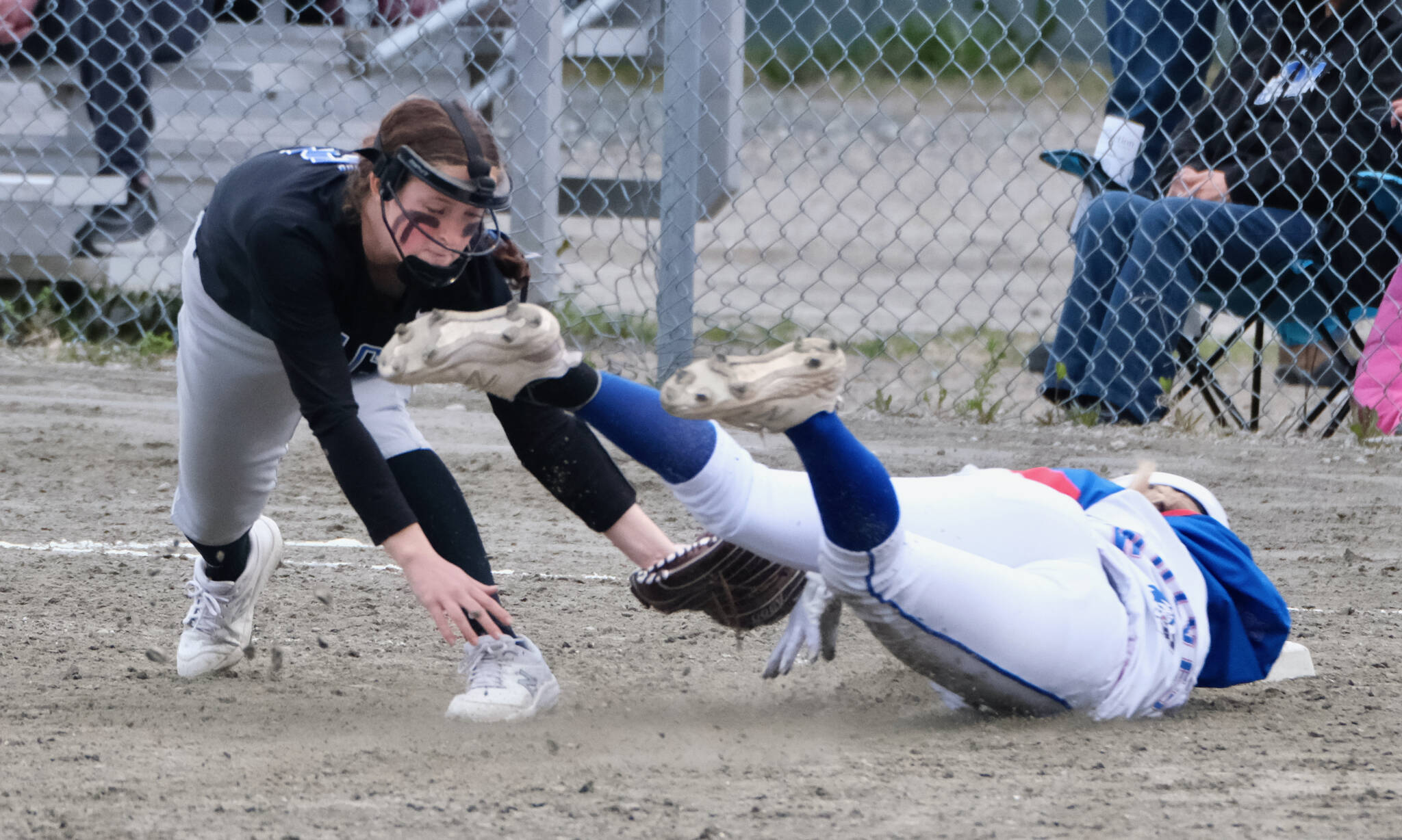 Thunder Mountain freshman third baseman Cambry Lockhart tags out Sitka base runner Adriana Denkiner during the Falcons 11-3 win over the Lady Wolves, Thursday, at Dimond Park. (Klas Stolpe / Juneau Empire)