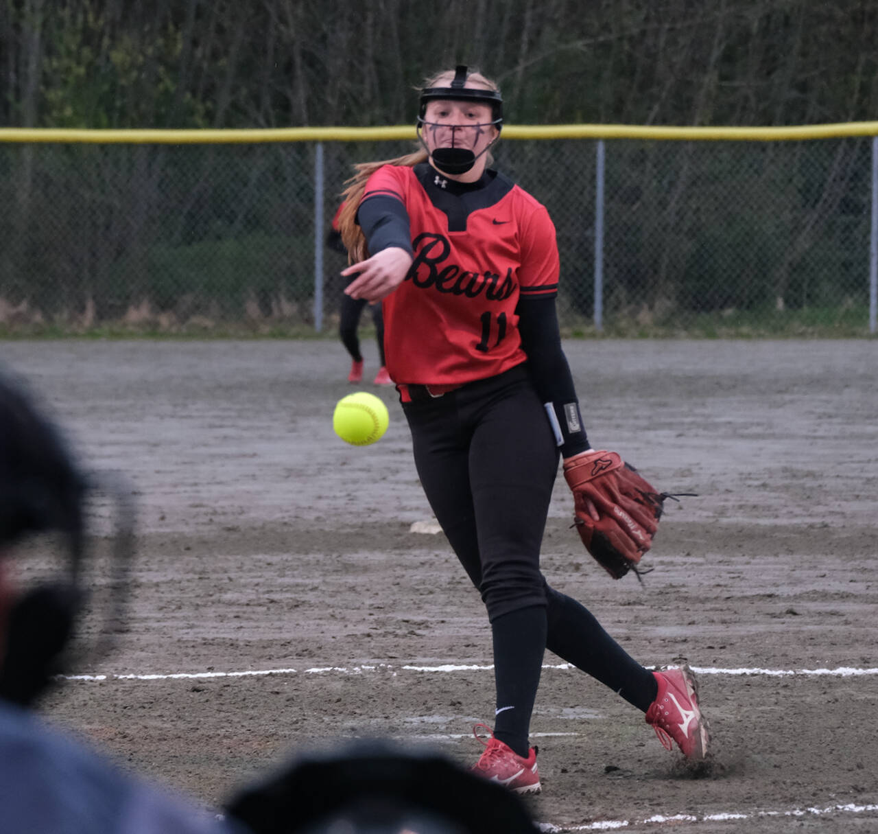 Juneau-Douglas High School: Yadaa.at Kalé senior Mariah Schauwecker (11) pitches during the Crimson Bears 10-9 win over the Sitka Lady Wolves, Friday, at Melvin Park. (Klas Stolpe / Juneau Empire)