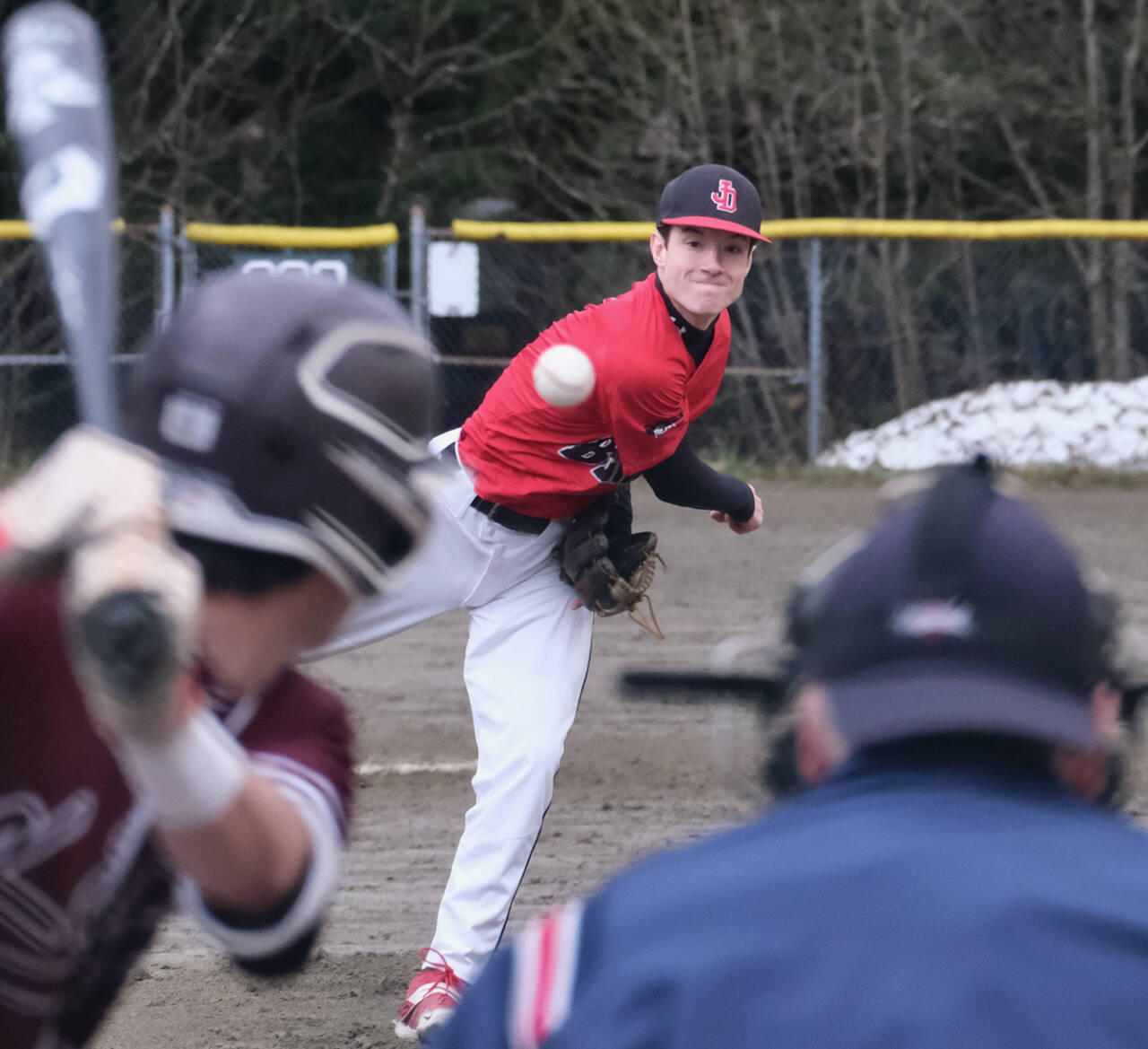 Juneau-Douglas High School: Yadaa.at Kalé senior pitcher Eli Crupi delivers against Ketchikan’s Colby Hanchey during the Crimson Bears 5-4 win over the visiting Kings on Friday at Adair Kennedy Field. (Klas Stolpe / Juneau Empire)