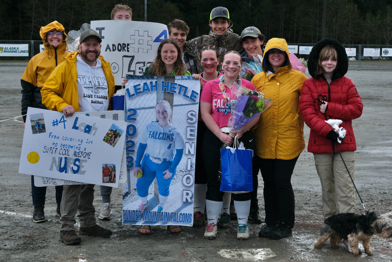 Thunder Mountain senior softball player Leah Hetle, shown surrounded by family, was honored on Saturday at Dimond Park Field No. 4 before the Lady Falcons final home game against Ketchikan. (Klas Stolpe / Juneau Empire)