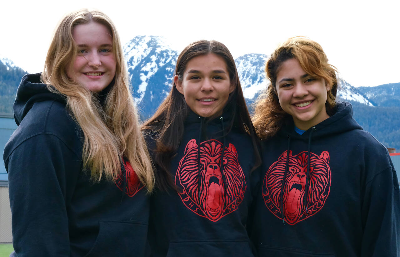 Juneau-Douglas High School: Yadaa.at Kalé girls soccer seniors, from left, Leni Schilling (an exchange student from Germany), Mariah Kadinger and Angelica Rodriguez will be honored before the Crimson Bears match against Thunder Mountain at 5 p.m. Tuesday on the Adair Kennedy pitch. (Klas Stolpe / Juneau Empire)
