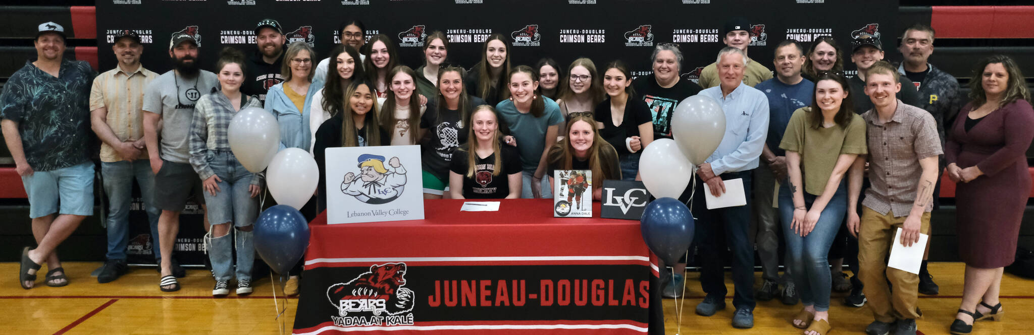 Juneau-Douglas High School: Yadaa.at Kalé senior Anna Dale, shown with family and friends, signed a letter of intent Monday to play hockey for Lebanon Valley College in Annville, Pennsylvania. (Klas Stolpe / Juneau Empire)