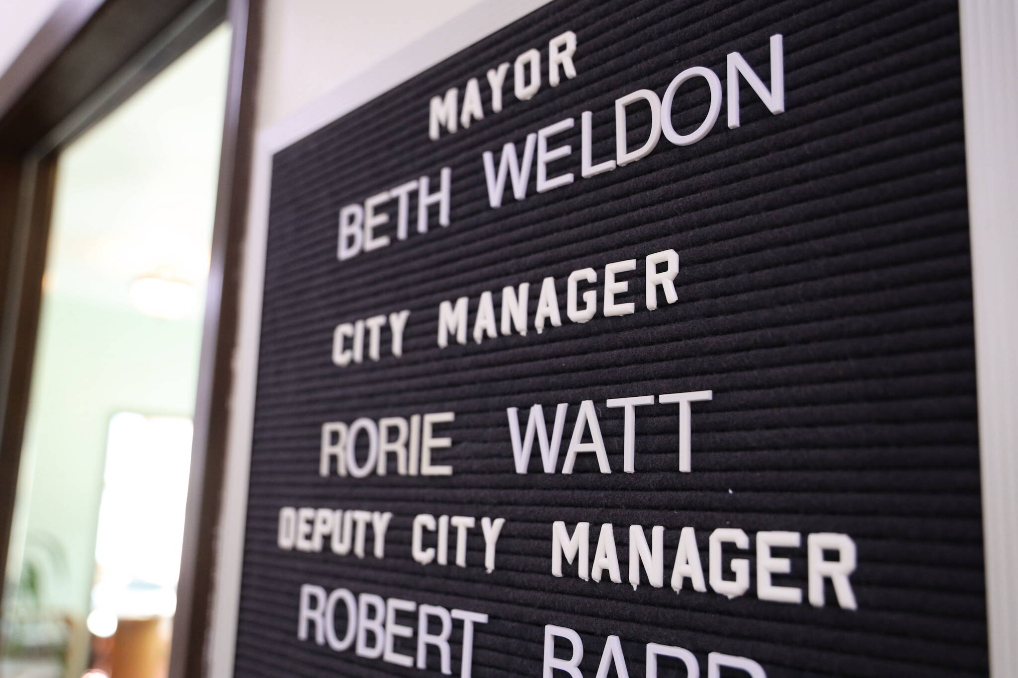 A sign hangs outside of outgoing City Manager Rorie Watt’s office located in the City Hall downtown. On Monday the Assembly City Manager Recruitment Committee met for the first time to discuss the recruitment process to hire Watt’s replacement by the end of September. (Clarise Larson / Juneau Empire)