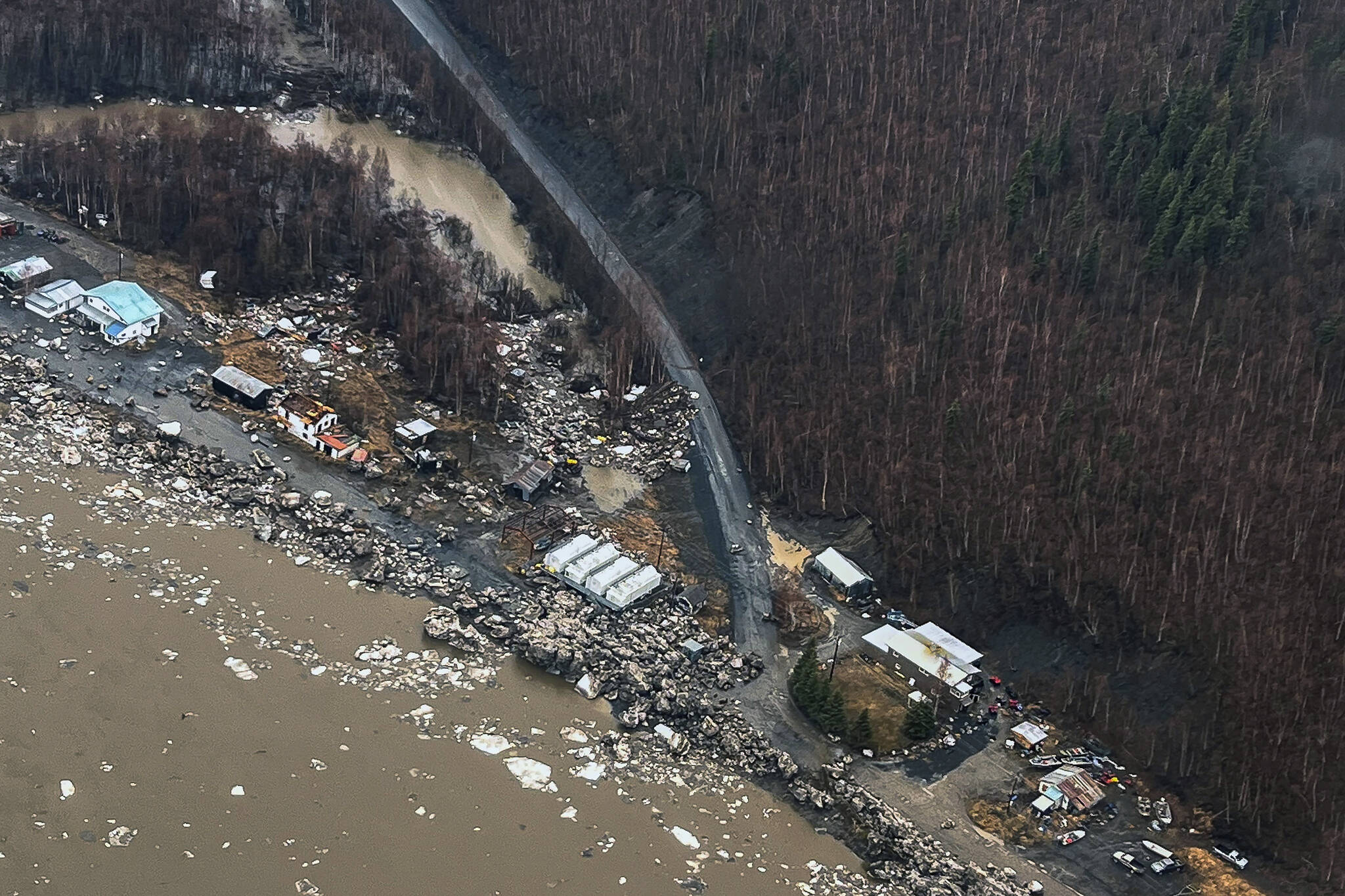 In this aerial photo chunks of ice follow flooding from an ice jam in Crooked Creek, Alaska, May 15, 2023. Ice jams along two Alaska rivers unleashed major flooding over the weekend. (Jennifer Wallace / Alaska Division of Homeland Security and Emergency Management)