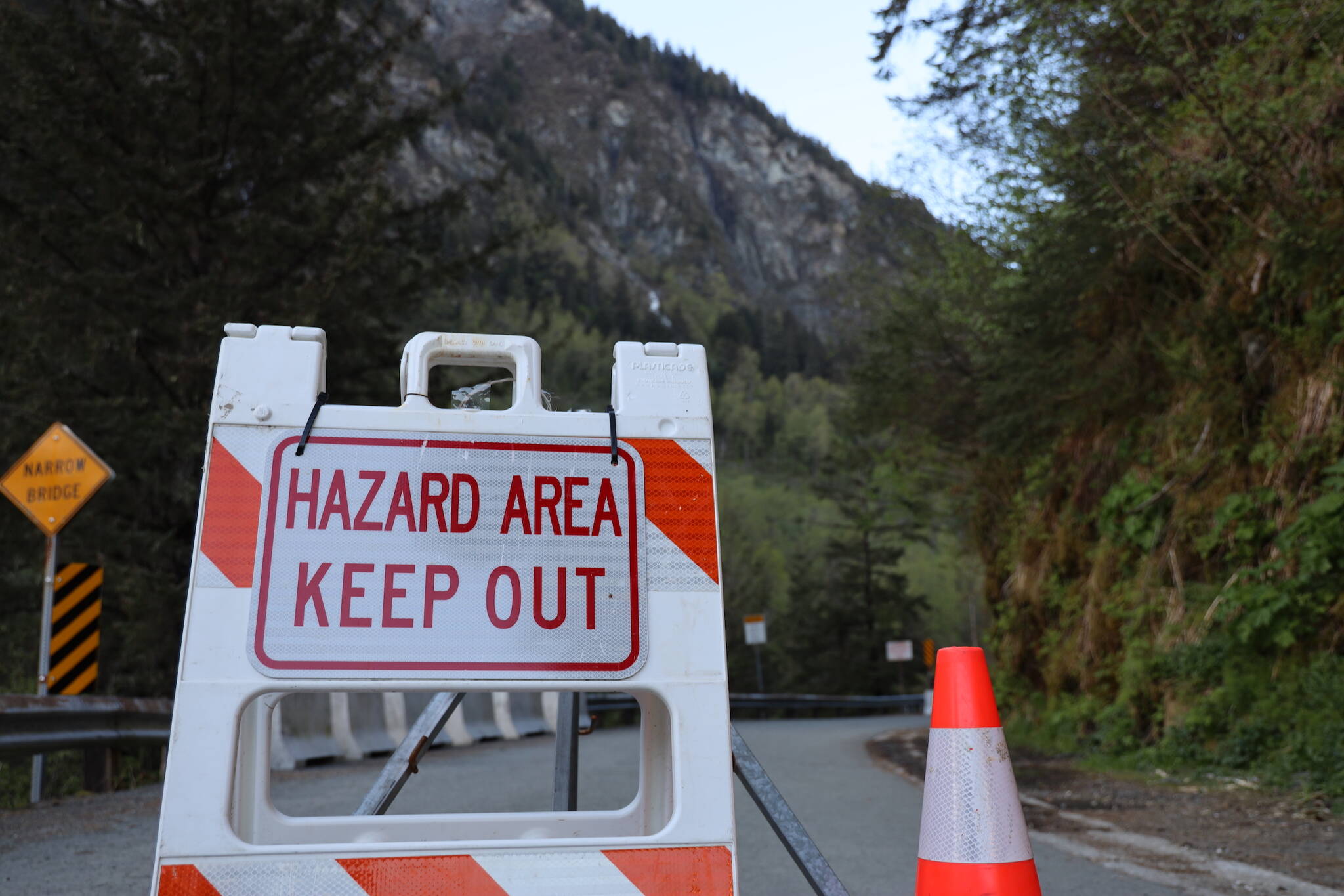 A hazard sign blocks the entrance of the Basin Road Trestle Tuesday evening. The trestle is set to close to pedestrian traffic spanning from May 26 to June 11 between 7 a.m. and 7 p.m. while a contracted construction company repairs damages the trestle suffered in January from a rockslide. (Clarise Larson / Juneau Empire)