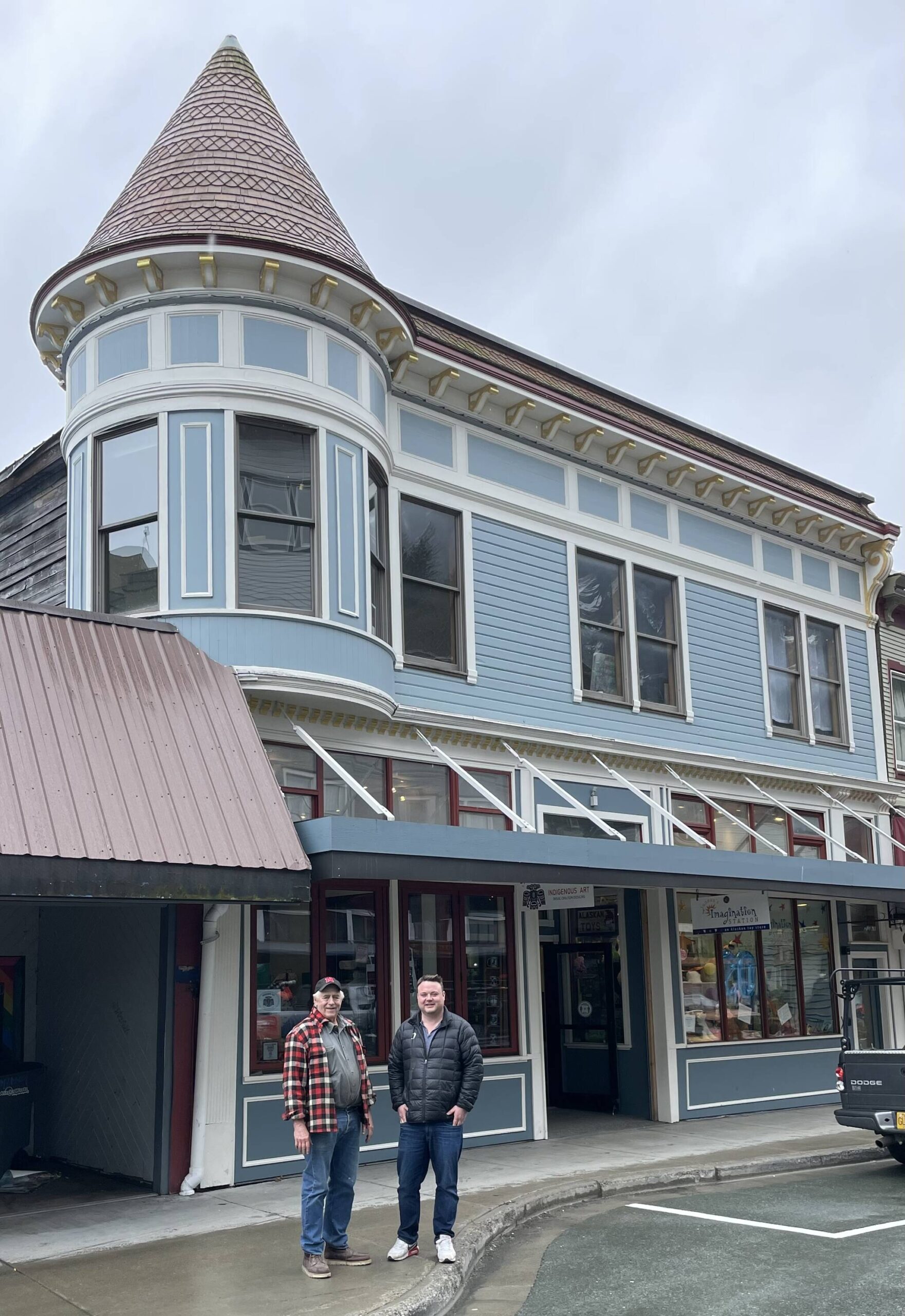 Neil MacKinnon and Jared Cure’ stand outside Juneau’s most recognizable historic building in April 2023. MacKinnon’s great-grandparents built the Alaska Steam Laundry in 1901. After several generations, MacKinnon sold the building to well-known local entrepreneur Jared Cure’ two months before COVID. (Laurie Craig / For the Downtown Business Association)