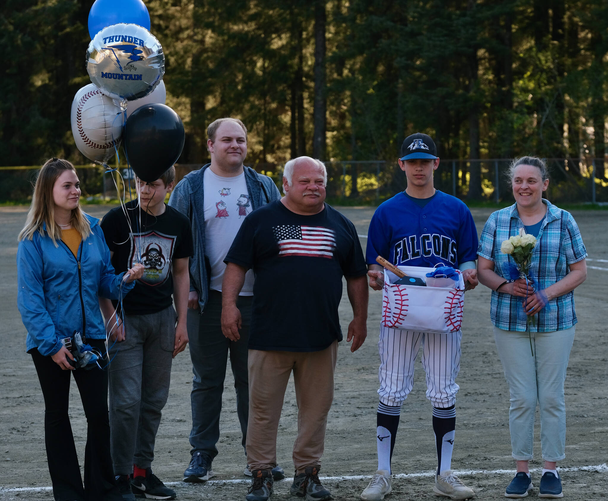 Thunder Mountain Falcons senior Carson Cummins and family were celebrated Wednesday at Adair-Kennedy Field. (Klas Stolpe / Juneau Empire)