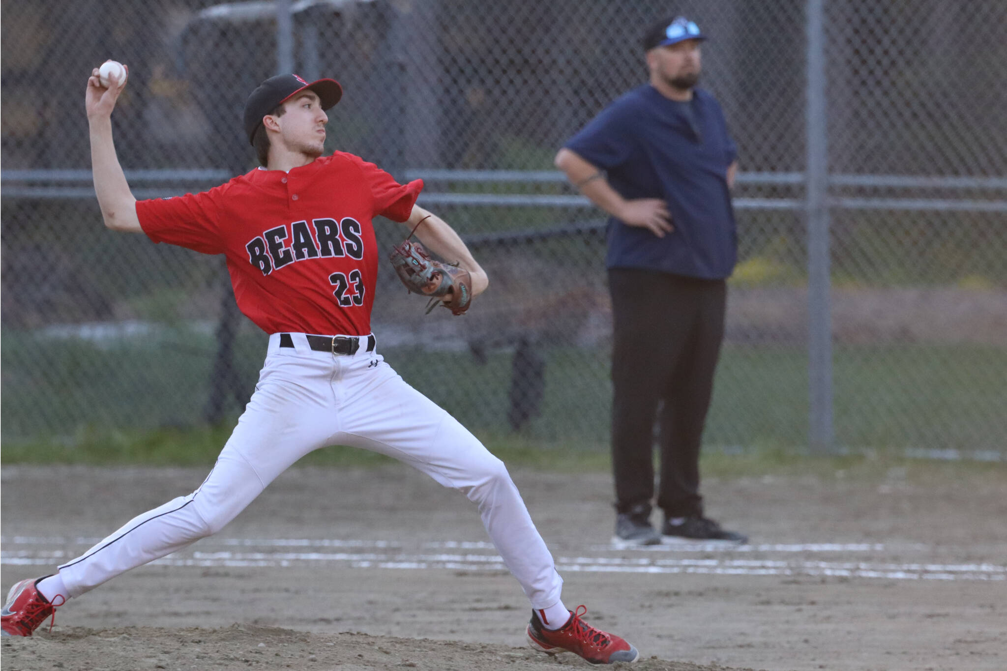 JDHS Joseph Aline pitches in last conference game against TMHS on Wednesday. Aline pitched for four of the five innings with three strikeouts, four hits and two runs. (Jonson Kuhn / Juneau Empire)