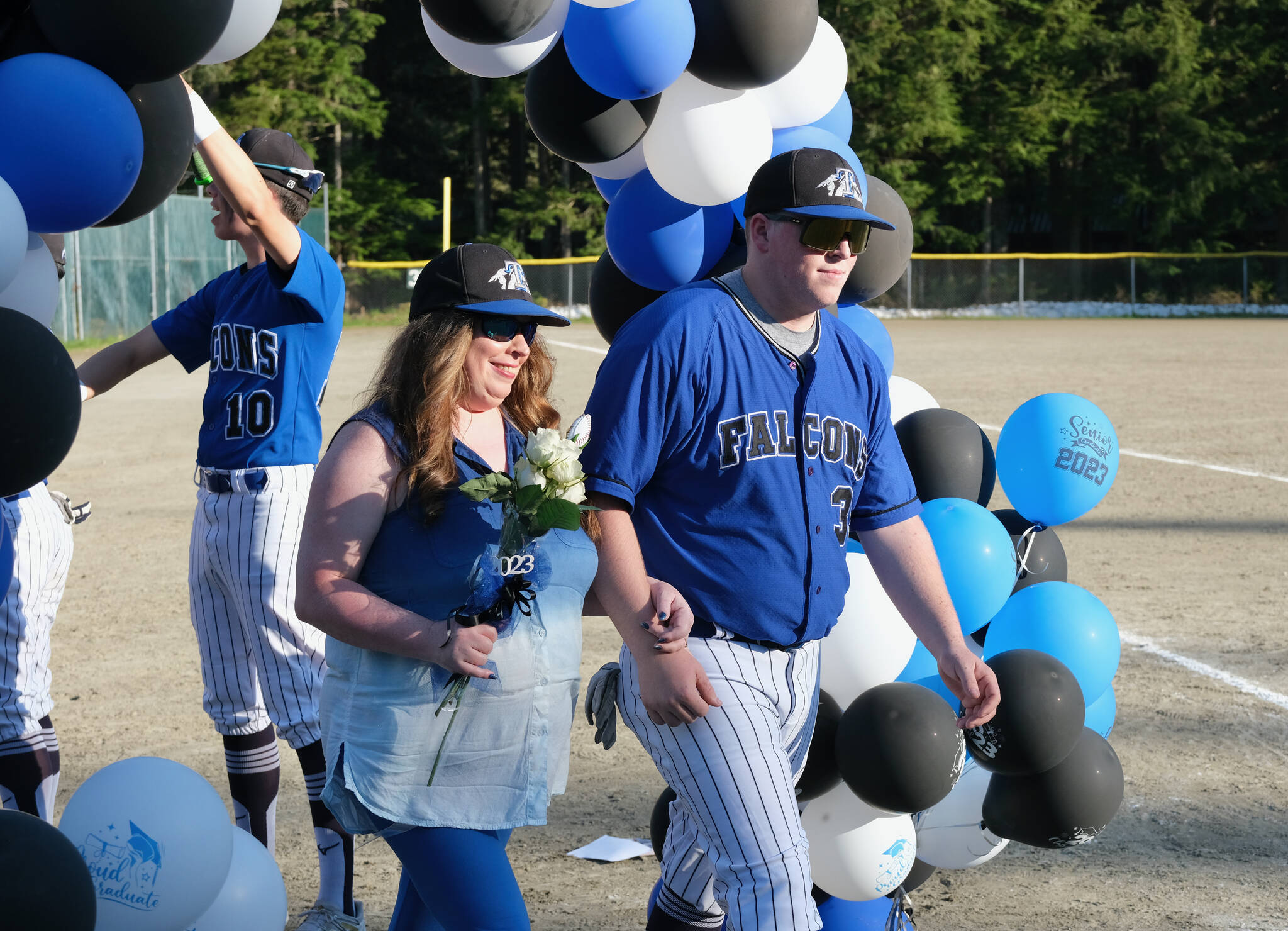 Thunder Mountain Falcons senior TJ Womack and family were celebrated Wednesday at Adair-Kennedy Field. (Klas Stolpe / Juneau Empire)