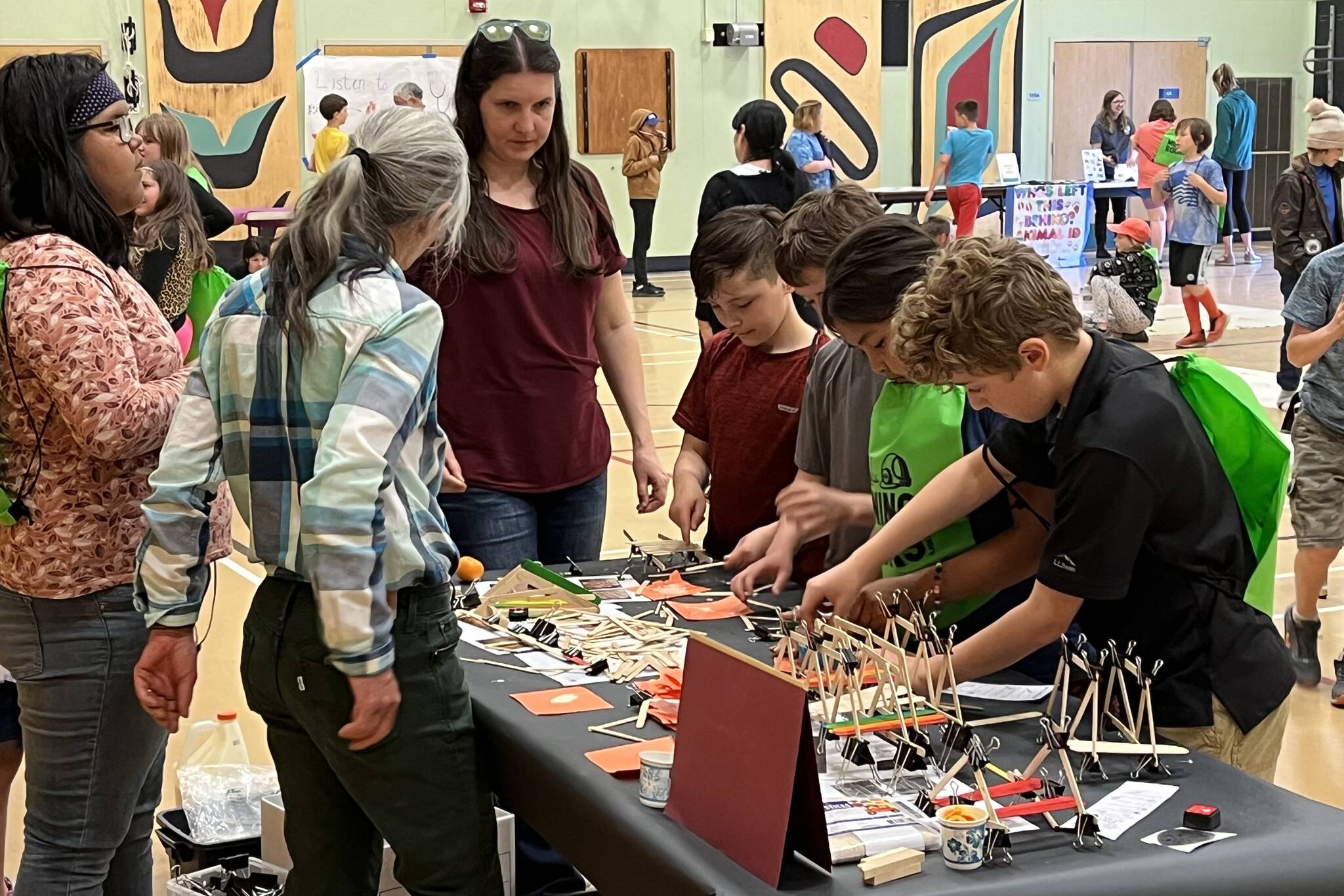 Robin Gilerist hosts the Bridge Building with University of Alaska Southeast, giving students a chance to build bridges of their own at Gilerist’s station on Thursday.