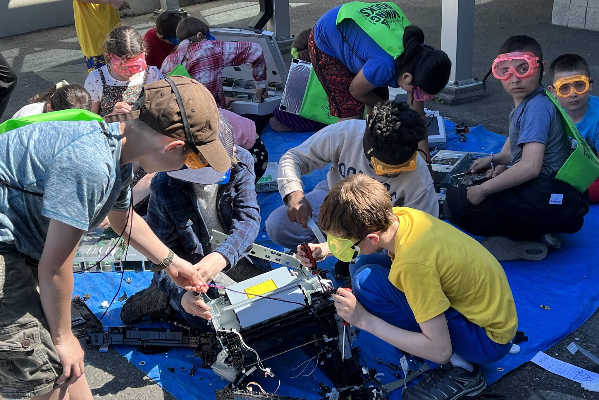 Students from Sayéik: Gastineau Community School took turns in disassembling mechanics with the Take Aparts with John Kajdan at this year’s STEAM event.