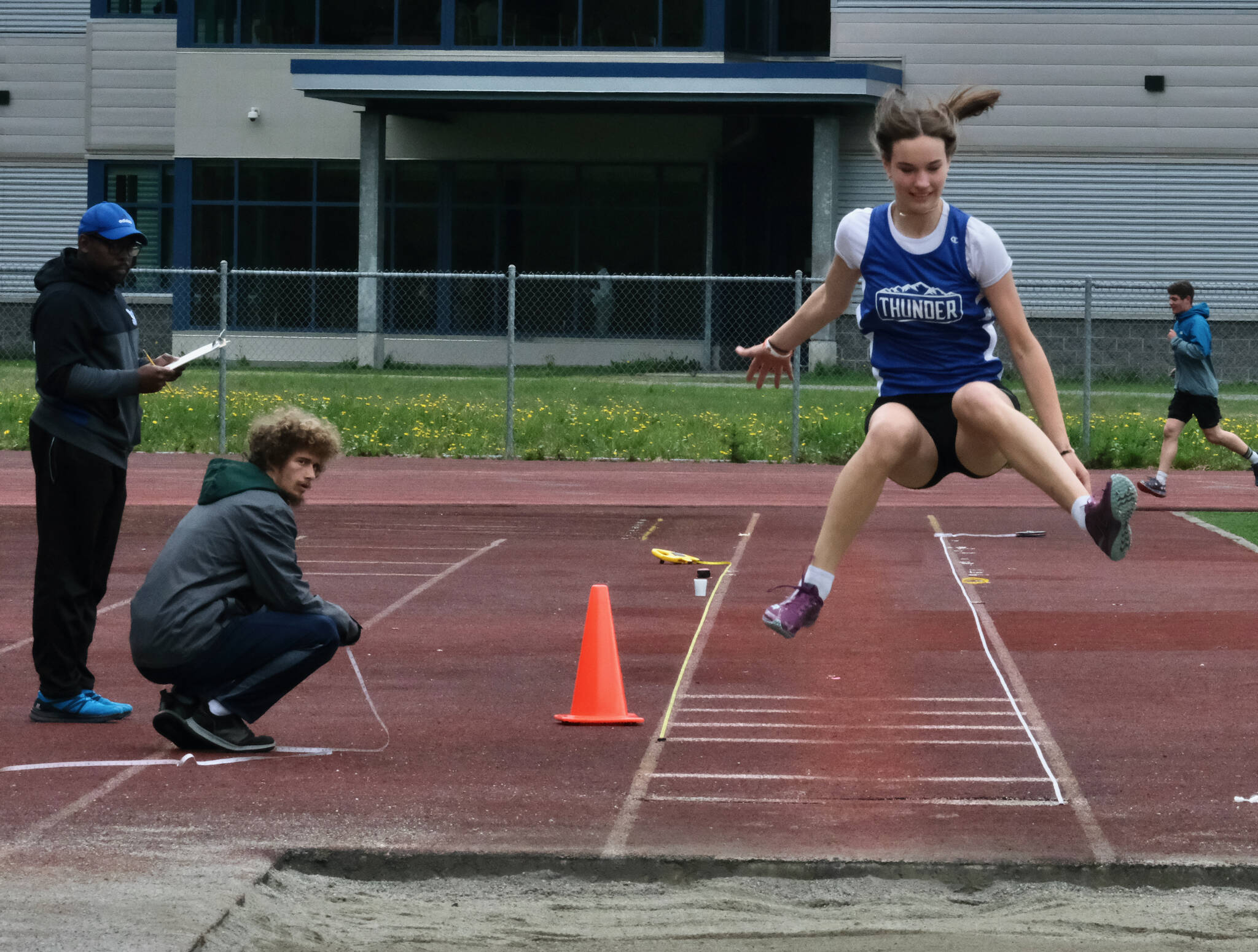TMHS sophomore Cailynn Baxter competes in the girls DI triple jump during the Region V Track & Field Championships, Friday, at Thunder Mountain. The championships resume Saturday. (Klas Stolpe / Juneau Empire)