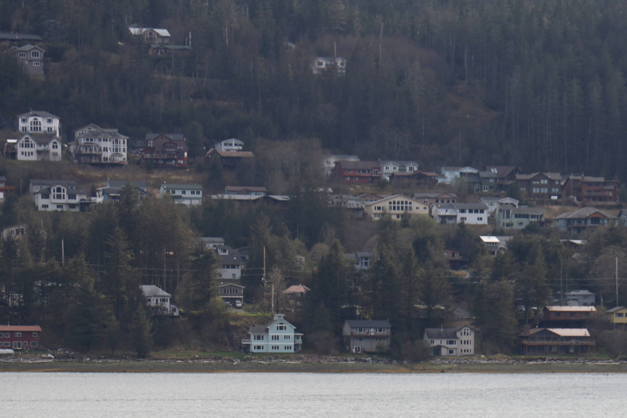 This is a picture of houses on Douglas along the Gastineau Channel in May. (Clarise Larson / Juneau Empire File)