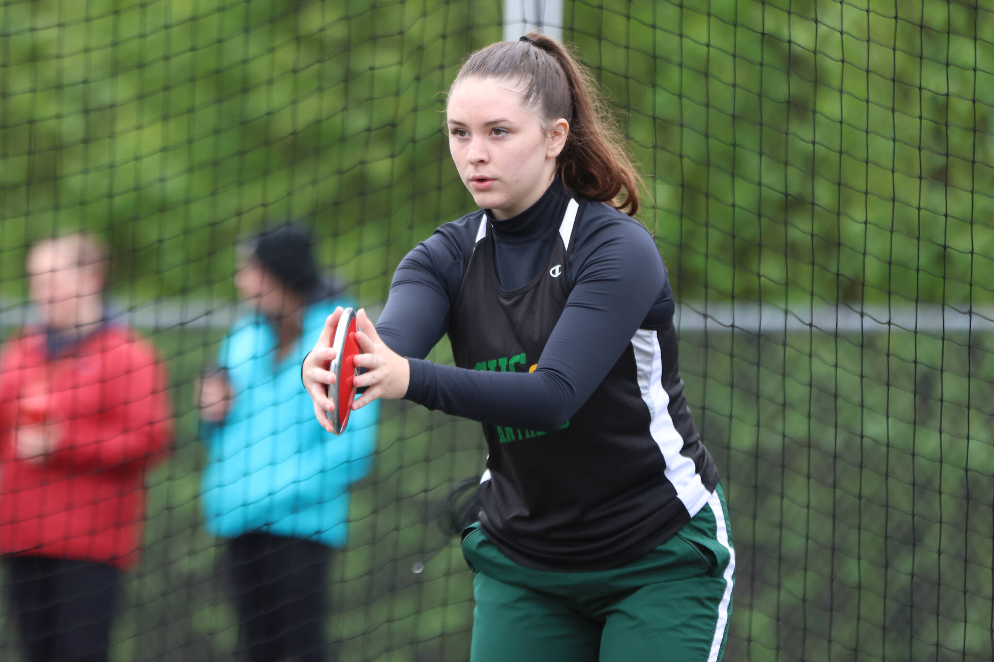 Alissa Durgan, a Craig High School senior, gets ready to give the discus a throw Saturday morning at Thunder Mountain High School. Durgan set a personal record during the Region V meet held in Juneau with a throw of 64 feet and 7 inches. (Ben Hohenstatt / Juneau Empire)