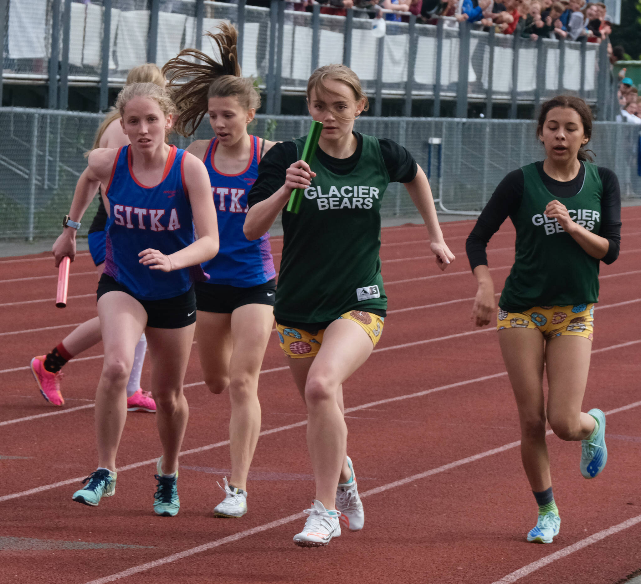 Klas Stolpe / Juneau Empire
Sitka sophomore Clare Mullin and Haines senior Avari Getchell start the anchor leg of the Division II girls 4x400 relay after taking baton passes from Sitka freshman Natalie Hall and Haines sophomore Ari’el Godinez Long during the Region V Track & Field Championships, Saturday at Thunder Mountain High School.